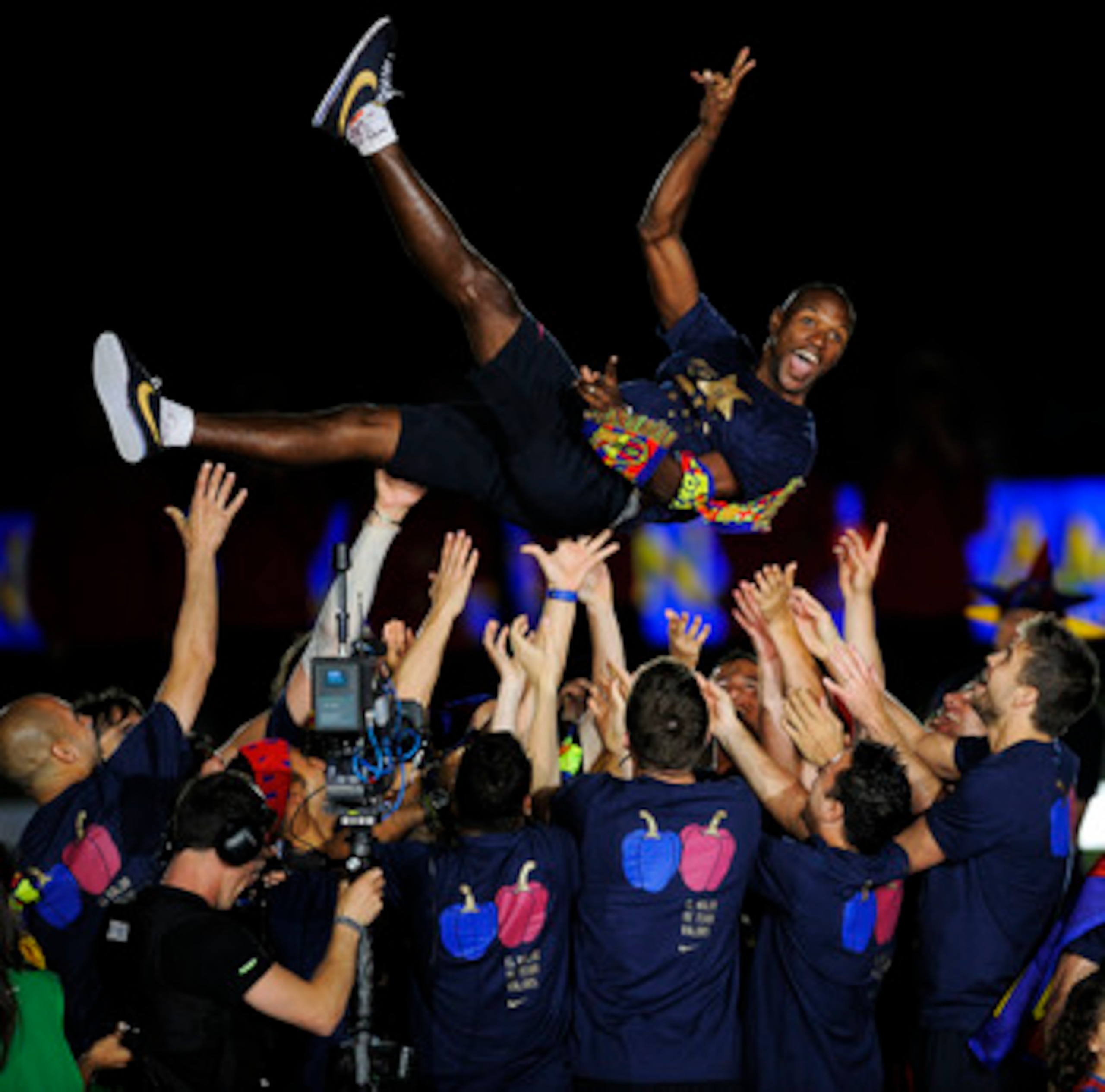 BARCELONA, SPAIN - MAY 13:  Eric Abidal of FC Barcelona is lifted by his team-mates during the celebrations for winning the Spanish Liga at the Camp Nou Stadium on May 13, 2011 in Barcelona, Spain.  (Photo by David Ramos/Getty Images)