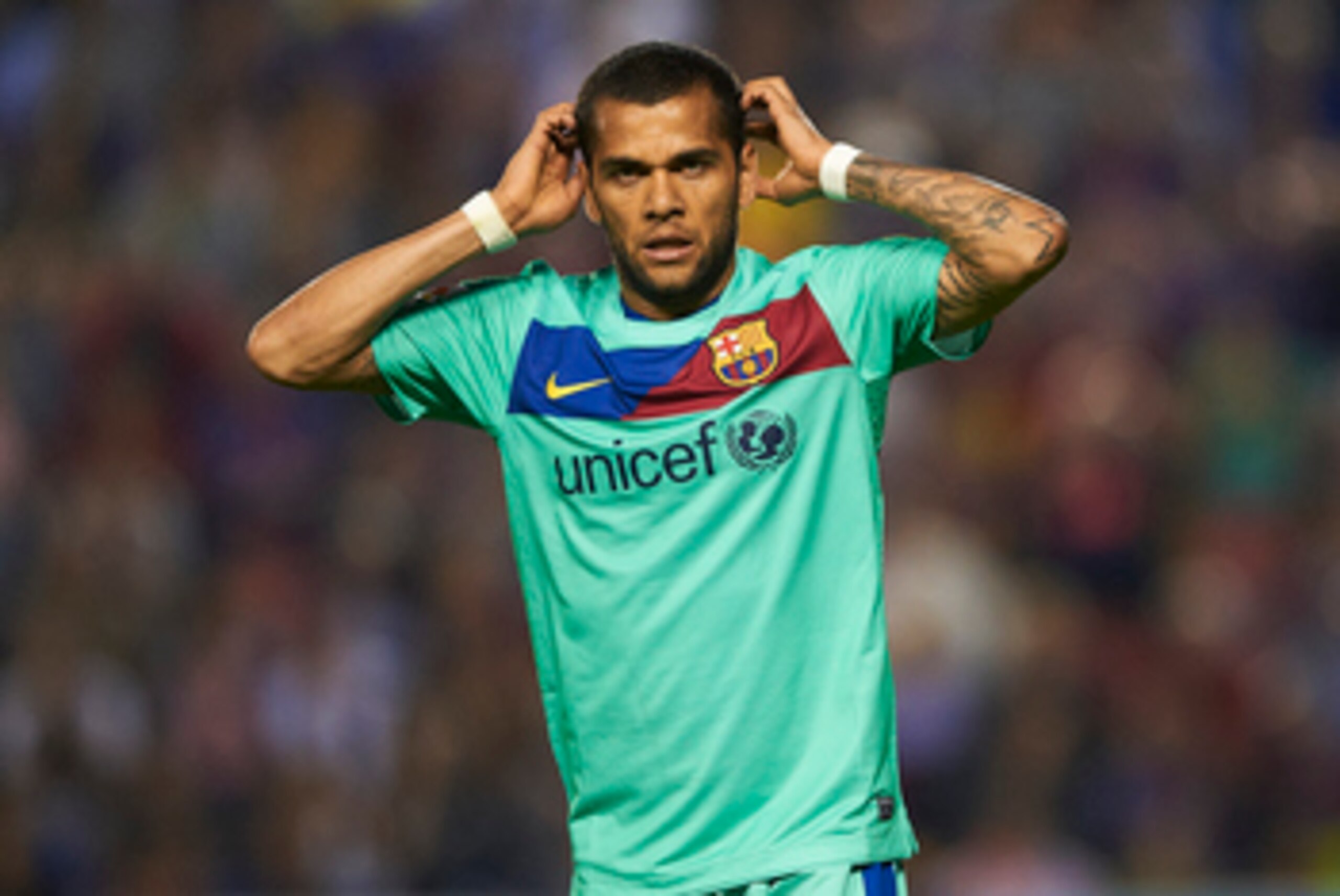 VALENCIA, SPAIN - MAY 11:  Daniel Alves of Barcelona reacts during the La Liga match between Levante UD and Barcelona at Ciutat de Valencia on May 11, 2011 in Valencia, Spain. The match ended 1-1.  (Photo by Manuel Queimadelos Alonso/Getty Images)