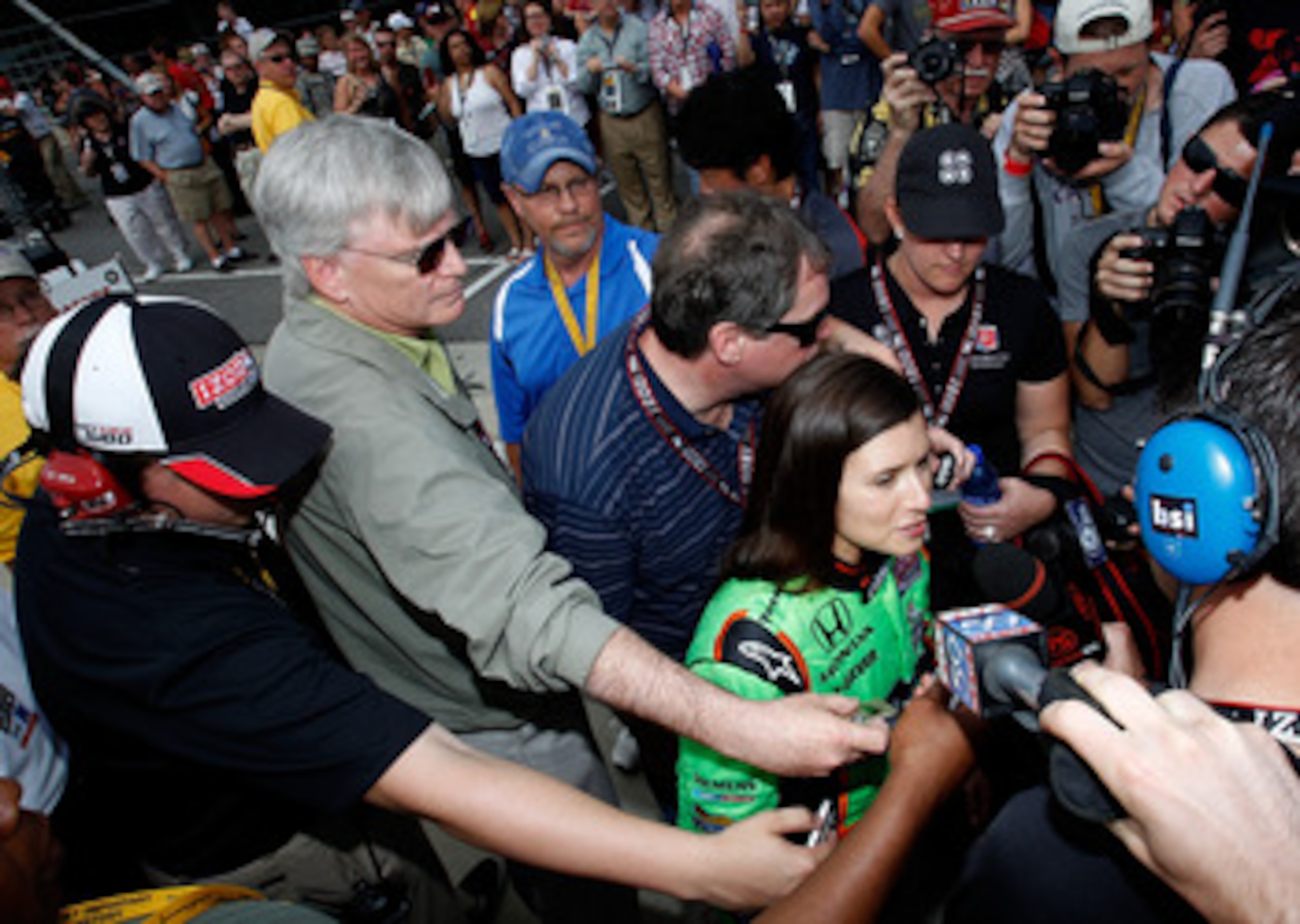 INDIANAPOLIS - MAY 22: Danica Patrick driver of the #7 Team GoDaddy Andretti Autosport Dallara Honda talks with the media after qualifying for the the 95th Indianapolis 500 Mile Race at the Indianapolis Motor Speedway on May 22, 2011 in Indianapolis, Indi