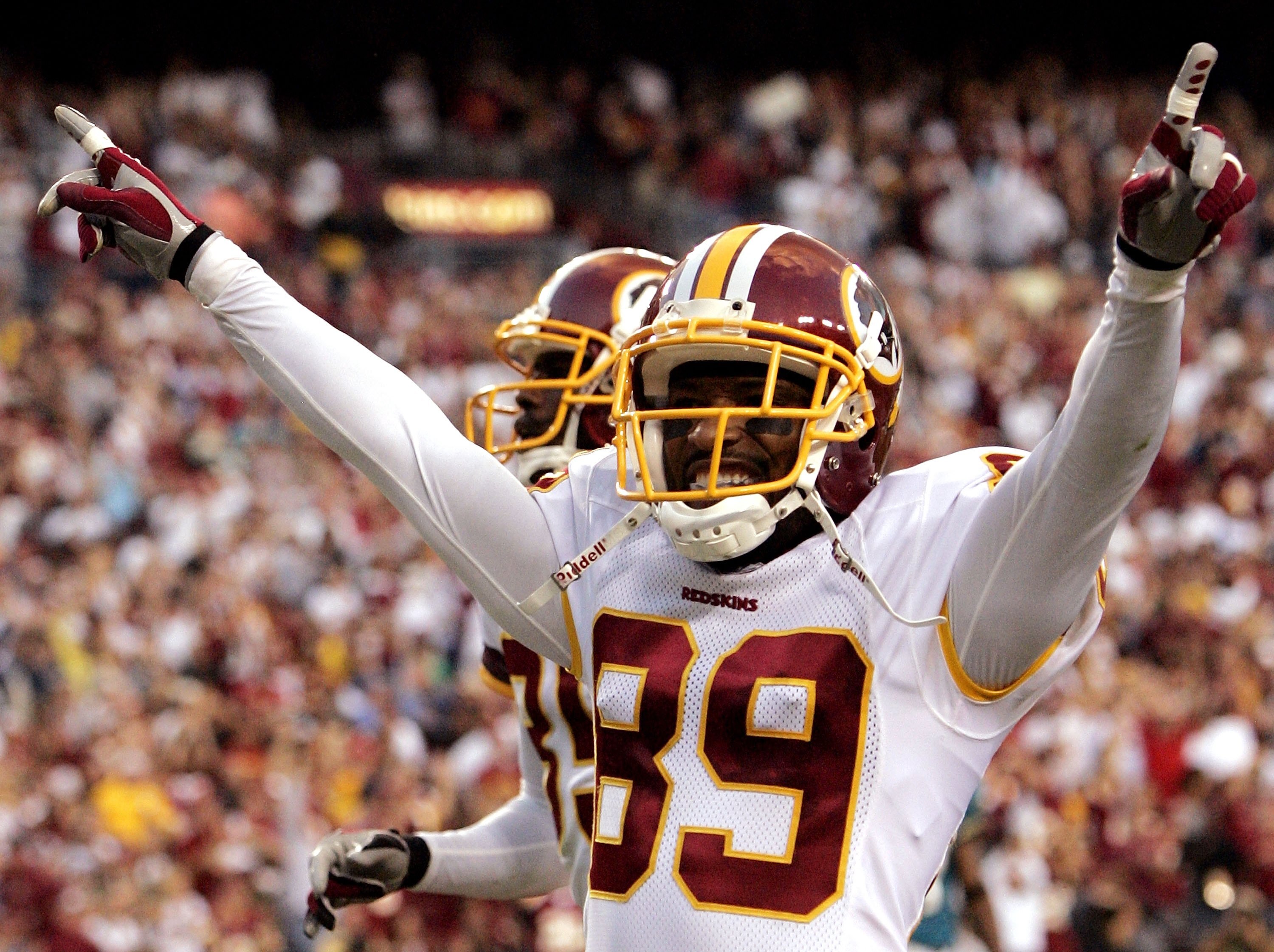 LANDOVER, MD - OCTOBER 01:  Washington Redskins wide receiver Santana Moss #89 celebrates after scoring a touchdown in fourth quarter action against the Jacksonville Jaguars October 1, 2006 at FedEx Field in Landover, Maryland.  (Photo by Win McNamee/Gett