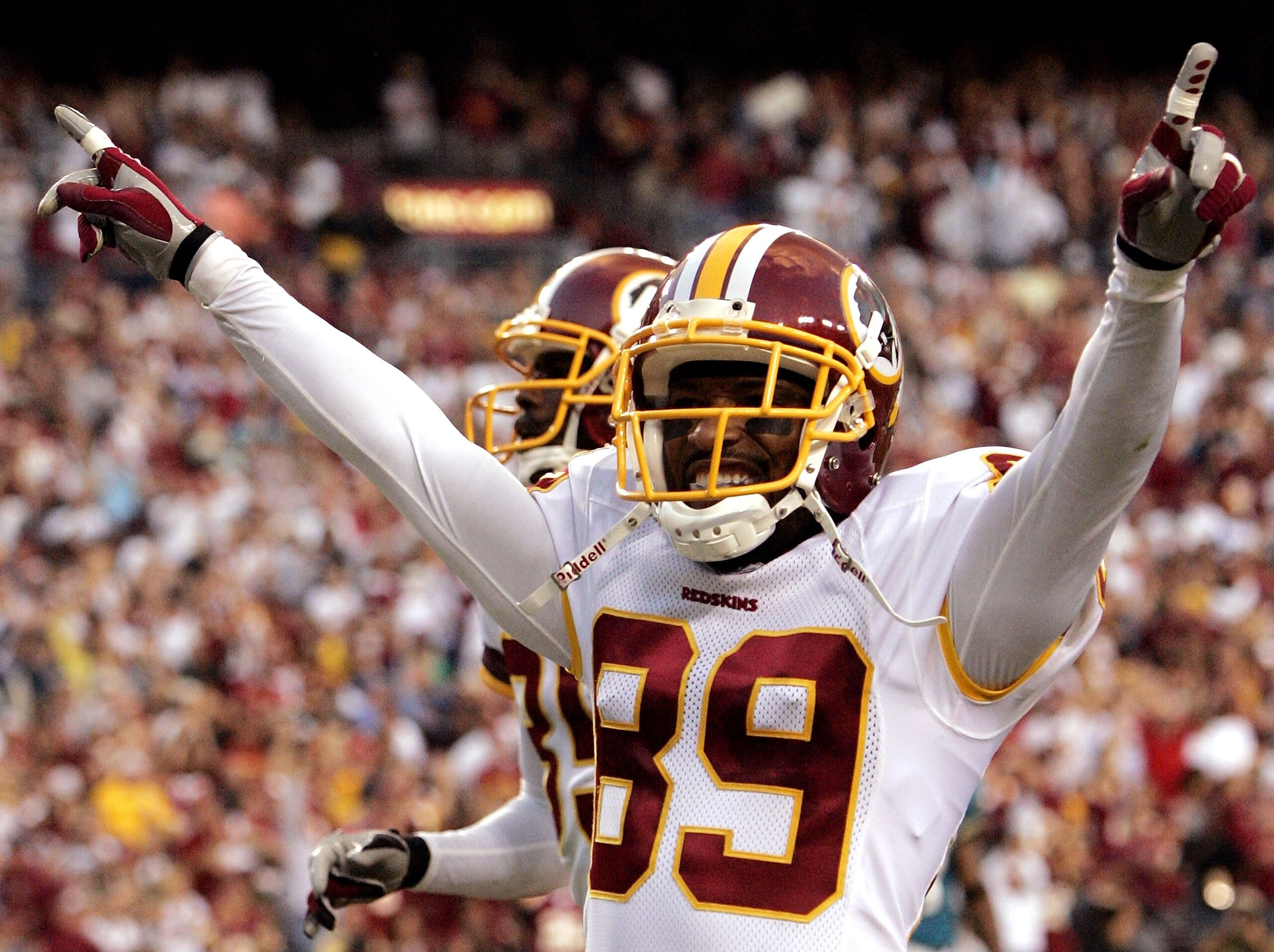LANDOVER, MD - OCTOBER 01:  Washington Redskins wide receiver Santana Moss #89 celebrates after scoring a touchdown in fourth quarter action against the Jacksonville Jaguars October 1, 2006 at FedEx Field in Landover, Maryland.  (Photo by Win McNamee/Gett
