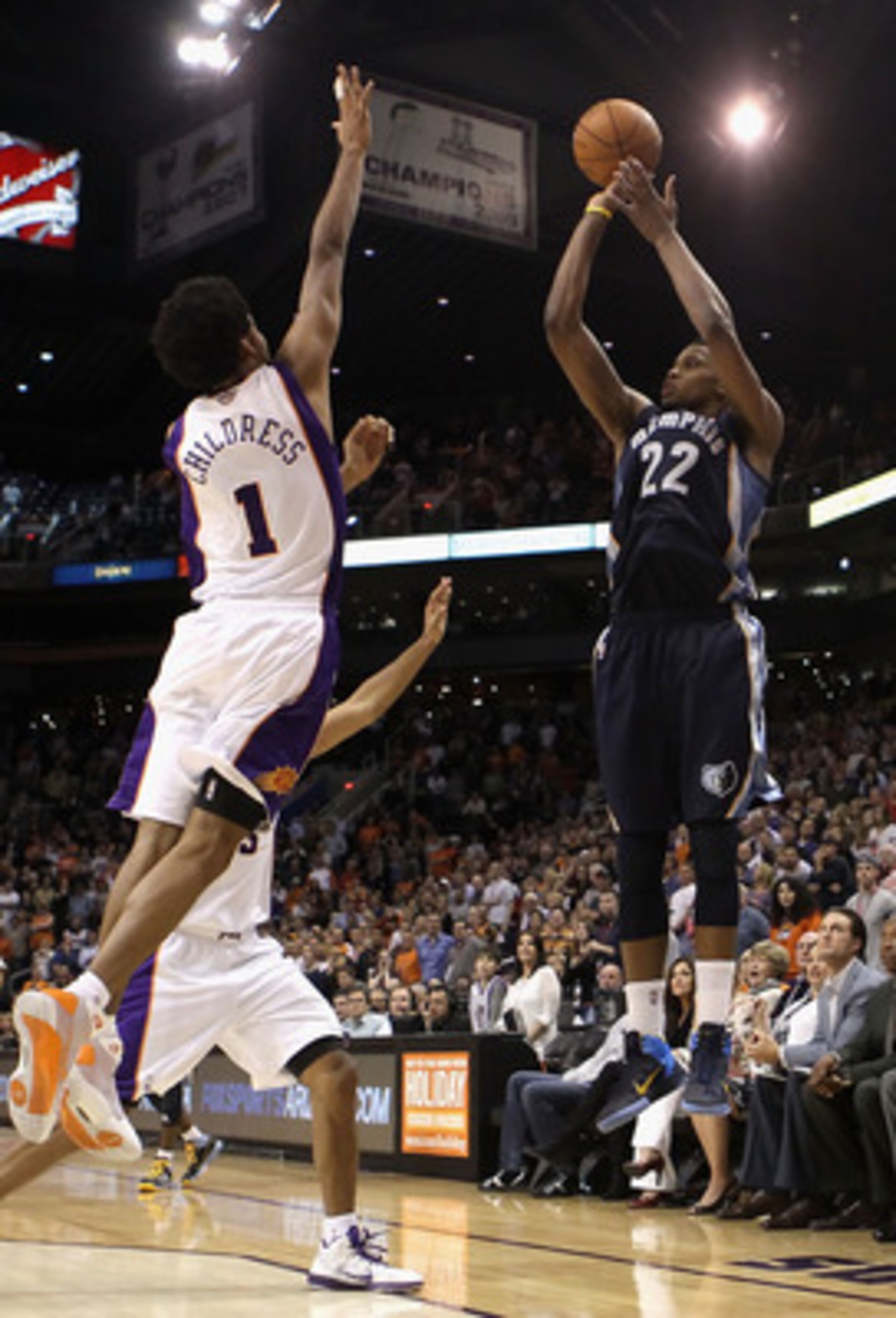 PHOENIX - DECEMBER 08:  Rudy Gay #22 of the Memphis Grizzlies puts up the game tying three point shot over Josh Childress #1 of the Phoenix Suns at the end of regulation in the NBA game at US Airways Center on December 8, 2010 in Phoenix, Arizona. The Gri