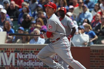 CHICAGO, IL - MAY 08: Joey Votto #19 of the Cincinnati Reds follows the flight of the ball against the Chicago Cubs at Wrigley Field on May 8, 2011 in Chicago, Illinois. The Reds defeated the Cubs 2-0.  (Photo by Jonathan Daniel/Getty Images)