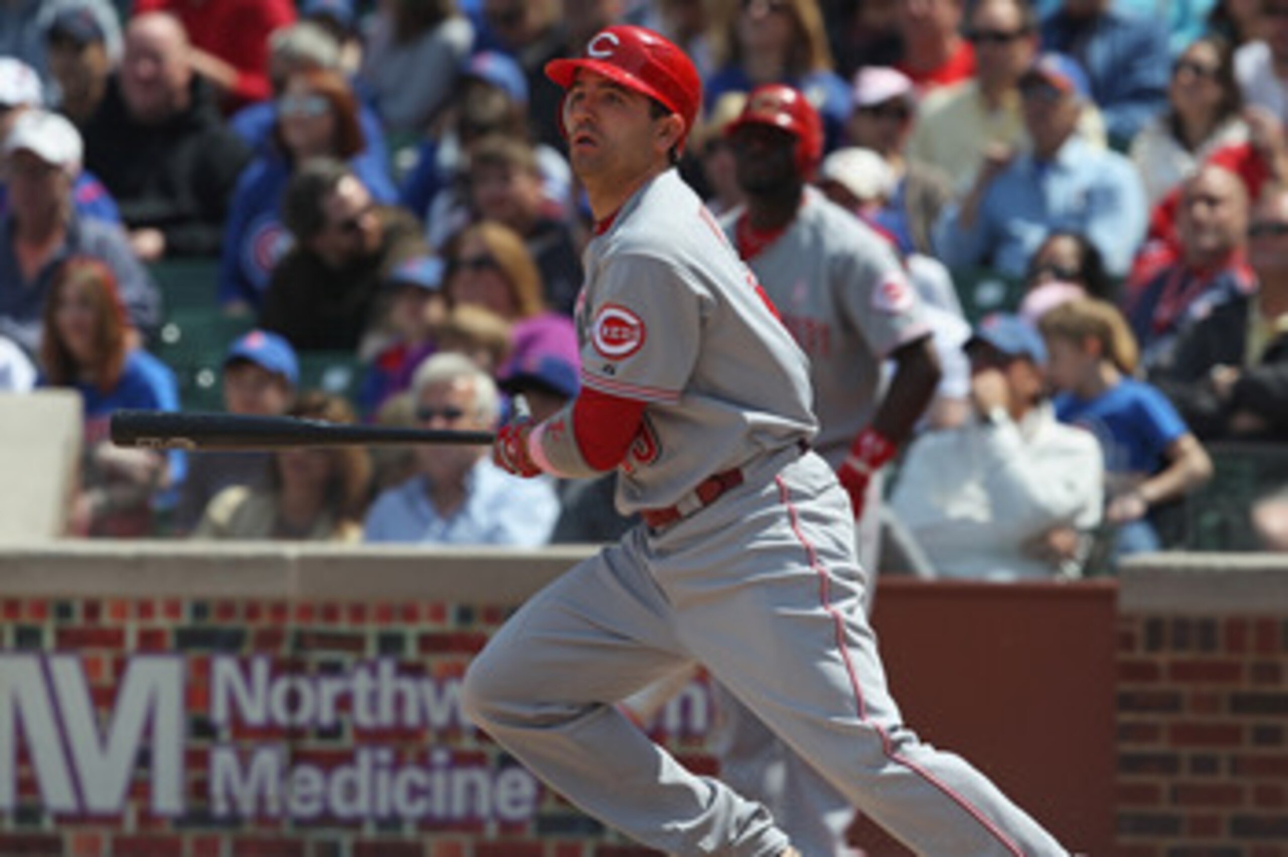 CHICAGO, IL - MAY 08: Joey Votto #19 of the Cincinnati Reds follows the flight of the ball against the Chicago Cubs at Wrigley Field on May 8, 2011 in Chicago, Illinois. The Reds defeated the Cubs 2-0.  (Photo by Jonathan Daniel/Getty Images)