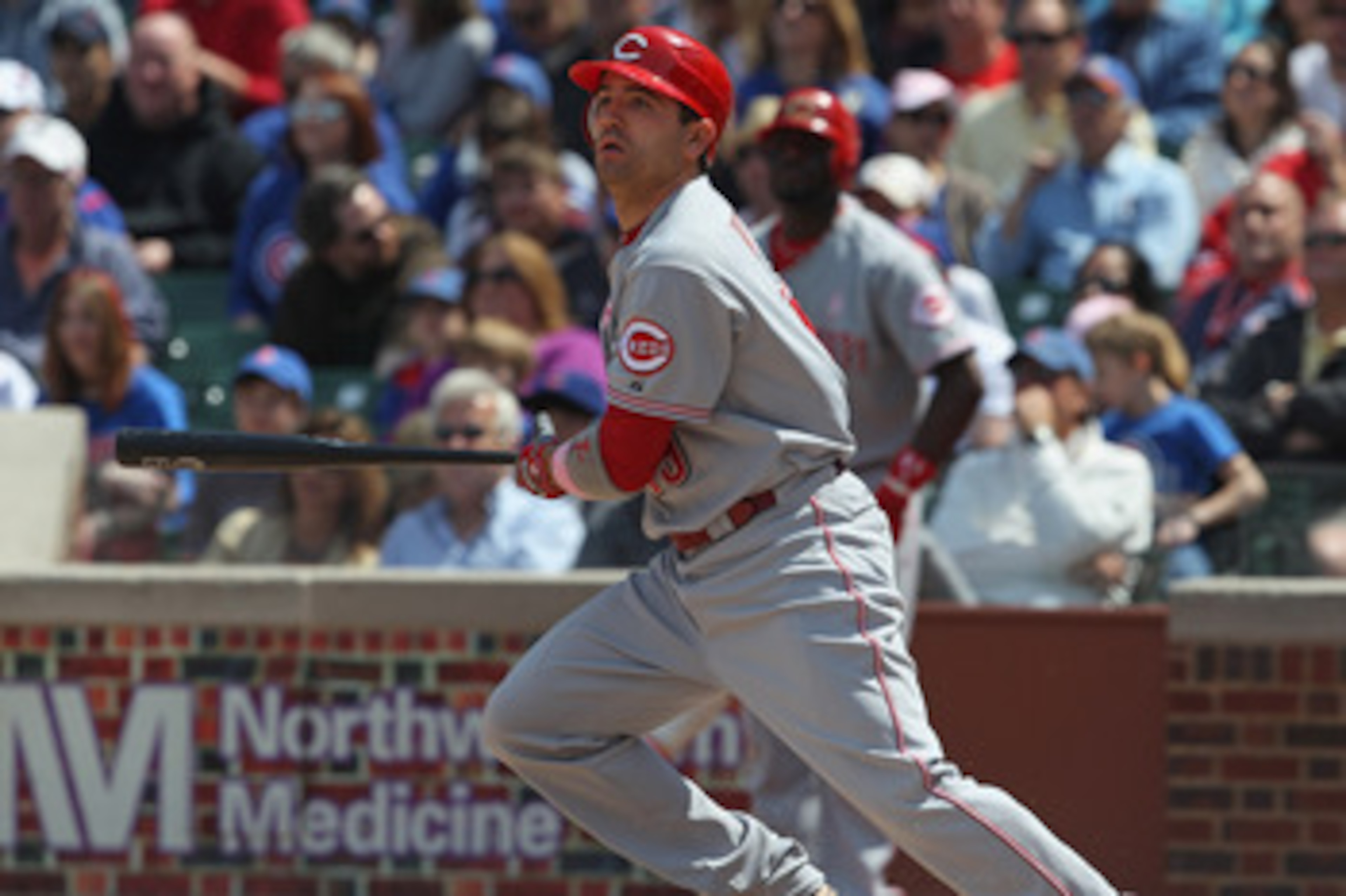 CHICAGO, IL - MAY 08: Joey Votto #19 of the Cincinnati Reds follows the flight of the ball against the Chicago Cubs at Wrigley Field on May 8, 2011 in Chicago, Illinois. The Reds defeated the Cubs 2-0. (Photo by Jonathan Daniel/Getty Images) CHICAGO, IL - MAY 08: Joey Votto #19 of the Cincinnati Reds follows the flight of the ball against the Chicago Cubs at Wrigley Field on May 8, 2011 in Chicago, Illinois. The Reds defeated the Cubs 2-0. (Photo by Jonathan Daniel/Getty Images)