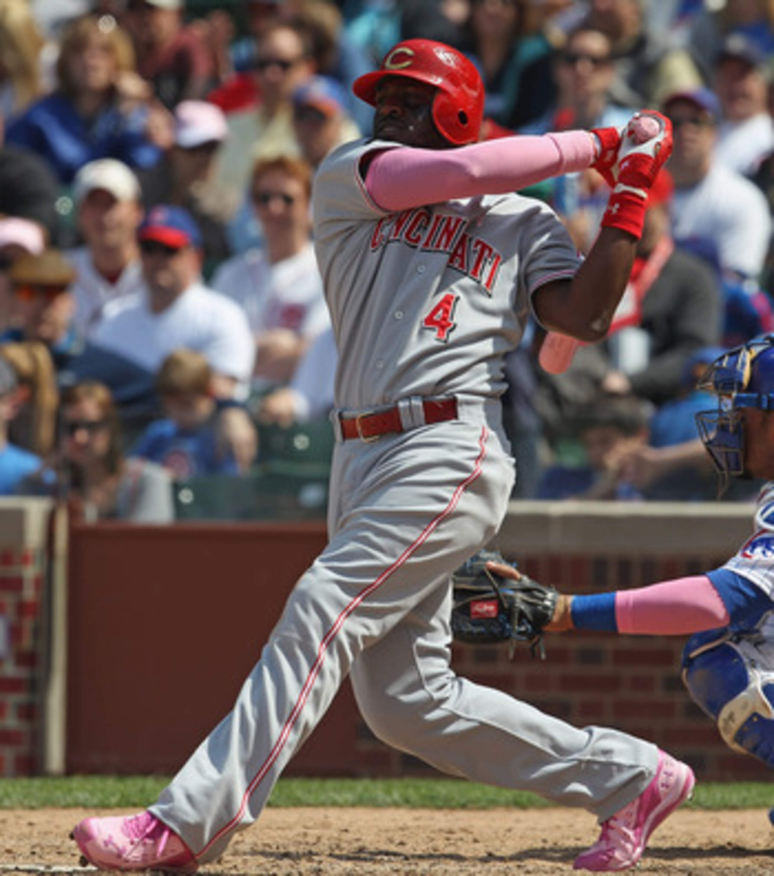 CHICAGO, IL - MAY 08: Brandon Phillips #4 of the Cincinnati Reds hits the ball against the Chicago Cubs at Wrigley Field on May 8, 2011 in Chicago, Illinois. The Reds defeated the Cubs 2-0. (Photo by Jonathan Daniel/Getty Images)