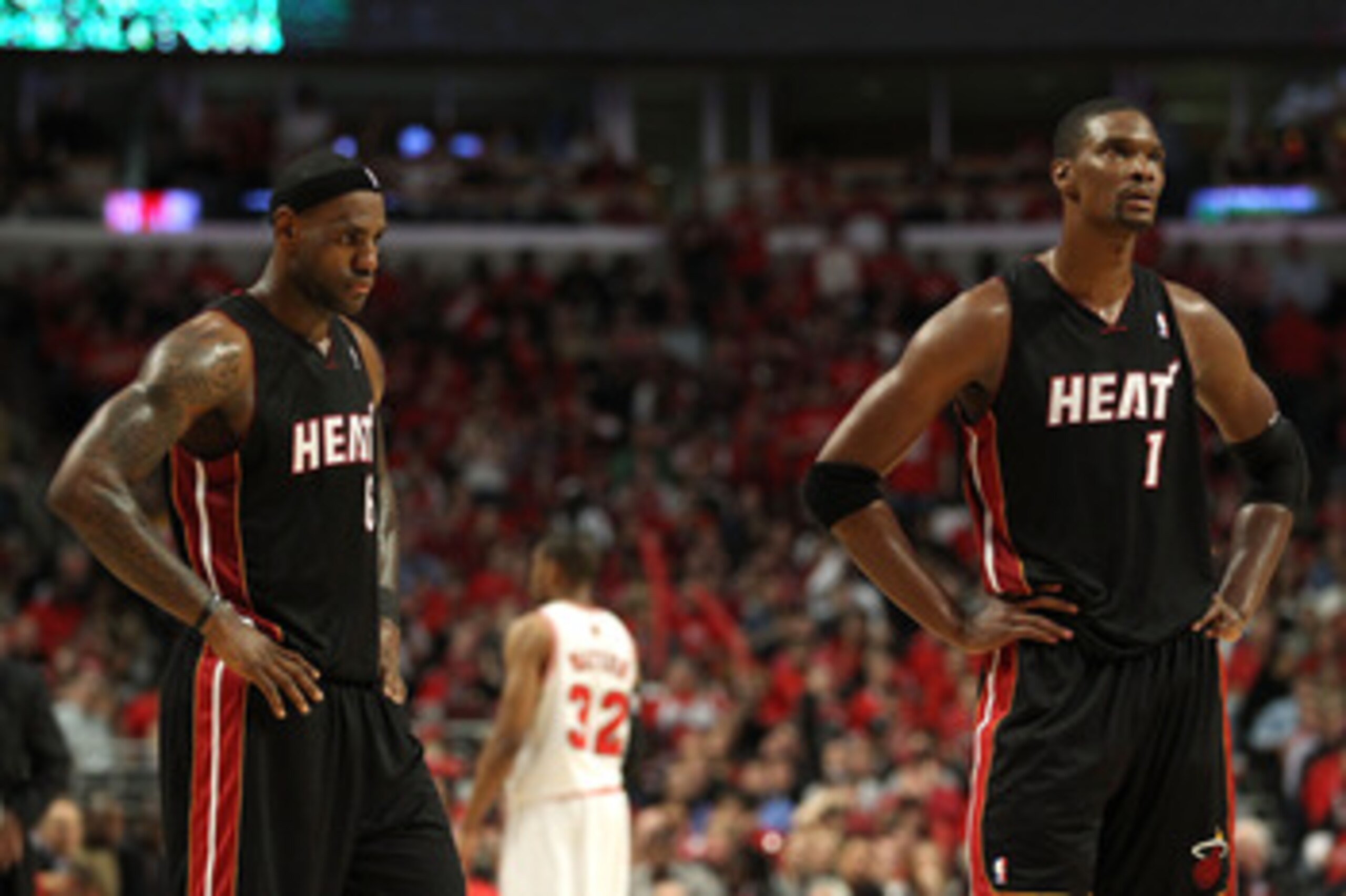 CHICAGO, IL - MAY 15: (L-R) LeBron James #6 and Chris Bosh #1 of the Miami Heat look on late in the fourth quarter against the Chicago Bulls in Game One of the Eastern Conference Finals during the 2011 NBA Playoffs on May 15, 2011 at the United Center in