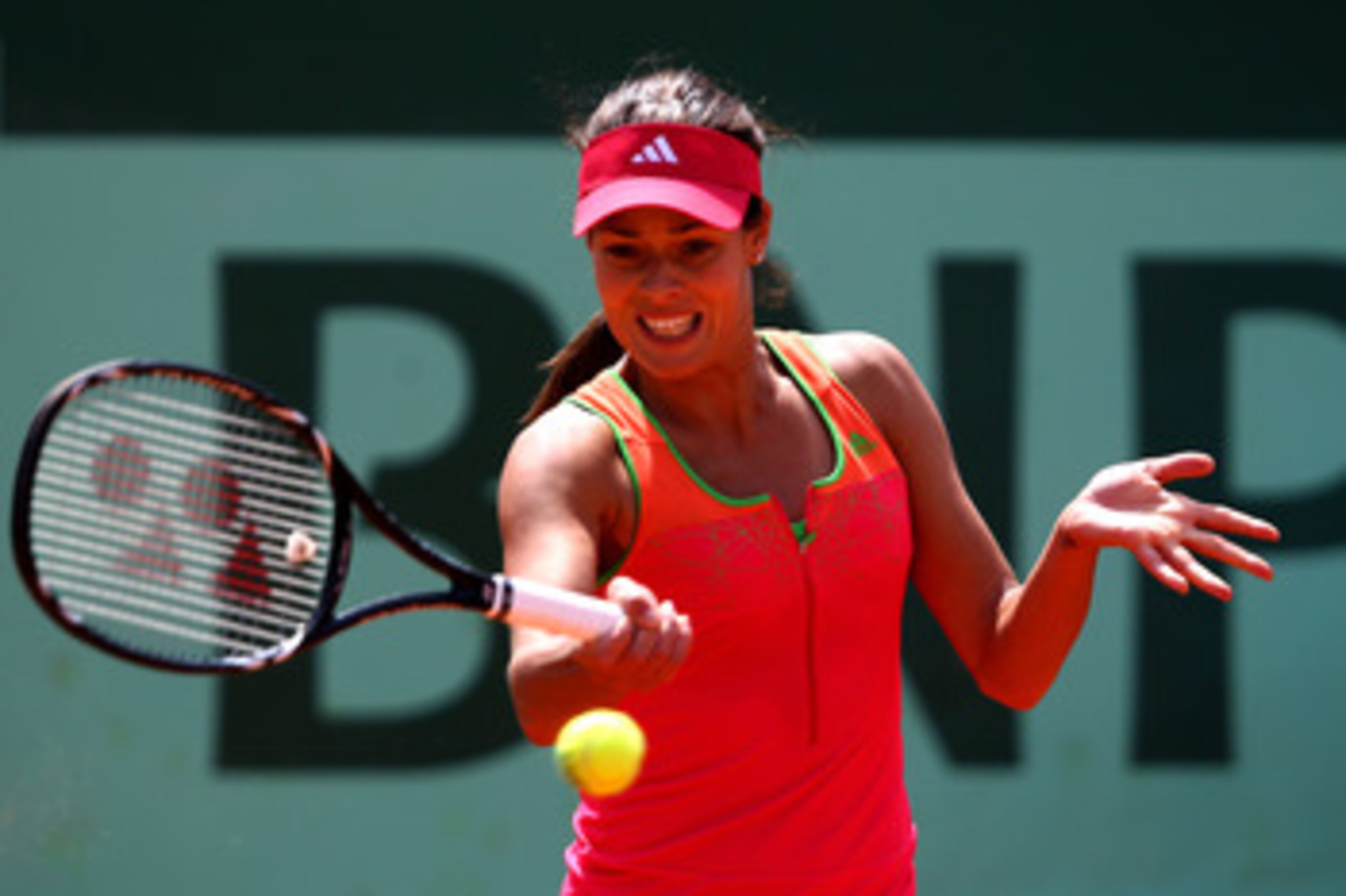 PARIS, FRANCE - MAY 24:  Ana Ivanovic of Serbia plays a forehand during the women's singles round one match between Johanna Larsson of Sweden and Ana Ivanovic of Serbia on day three of the French Open at Roland Garros on May 24, 2011 in Paris, France.  (P