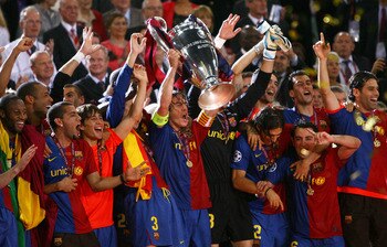 ROME - MAY 27:  Carles Puyol of Barcelona lifts the trophy as he and his team mates celebrates winning the UEFA Champions League Final match between Barcelona and Manchester United at the Stadio Olimpico on May 27, 2009 in Rome, Italy. Barcelona won 2-0.