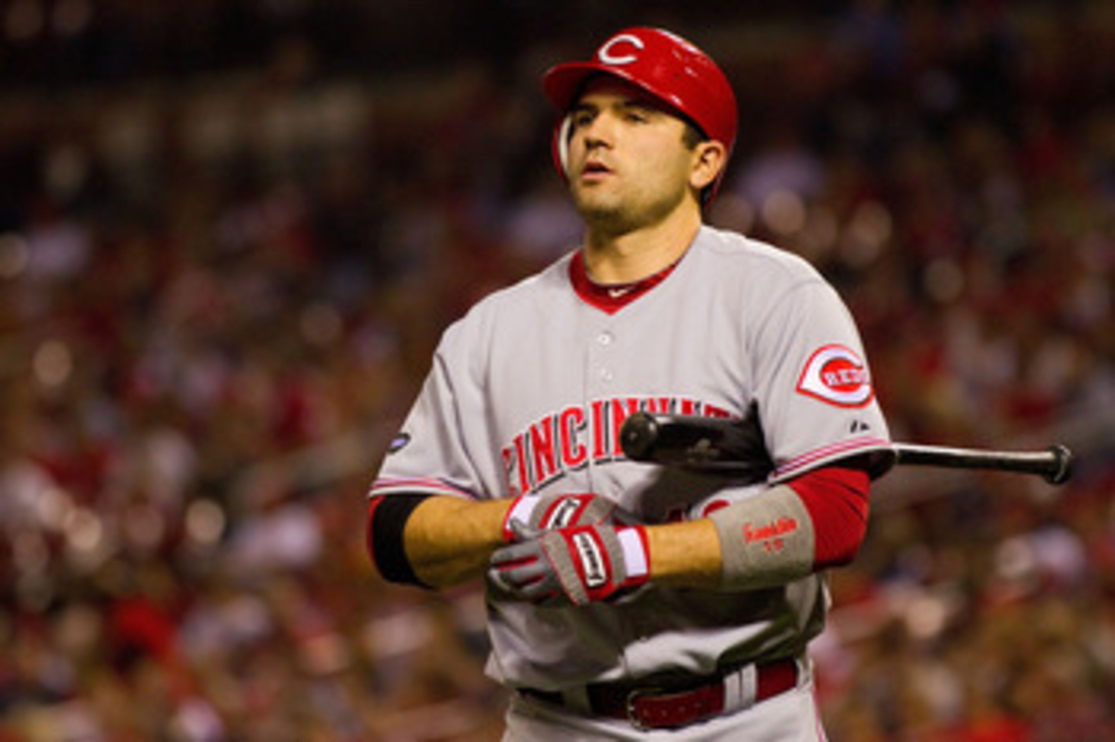 ST. LOUIS, MO - APRIL 22: Joey Votto #19 of the Cincinnati Reds returns to the dugout after striking out against the St. Louis Cardinals at Busch Stadium on April 22, 2011 in St. Louis, Missouri.  (Photo by Dilip Vishwanat/Getty Images)