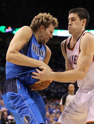OKLAHOMA CITY, OK - MAY 21:  Nick Collison #4 of the Oklahoma City Thunder attempts to steal the ball from Dirk Nowitzki #41 of the Dallas Mavericks in the fourth quarter in Game Three of the Western Conference Finals during the 2011 NBA Playoffs at Oklah