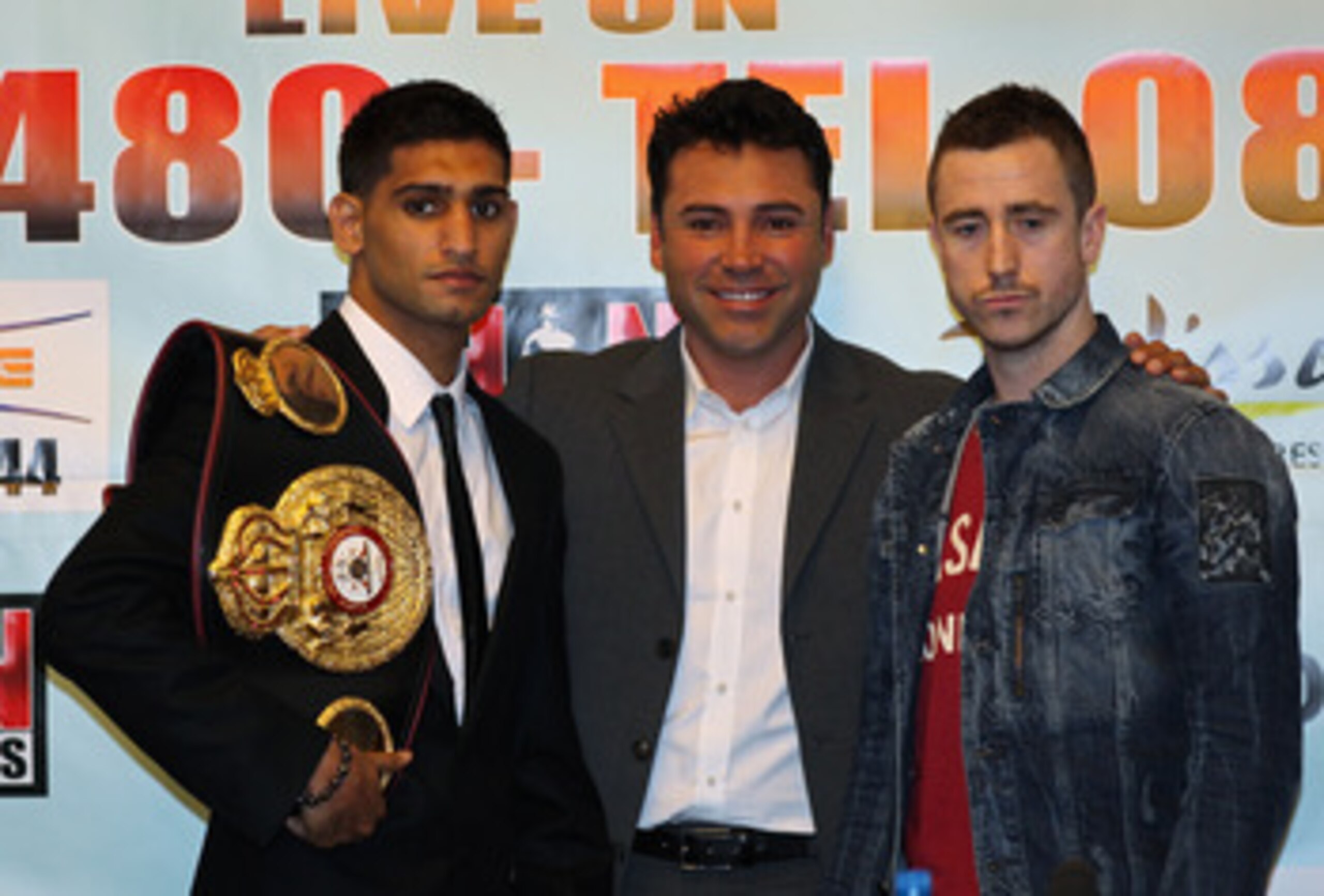MANCHESTER, ENGLAND - APRIL 14:  Amir Khan, Oscar de la Hoya the President of Golden Boy Promotions and Paul McCloskey pose for pictures after a press conference ahead of the WBA light-welterweight fight between Amir Khan and Paul McCloskey at Manchester