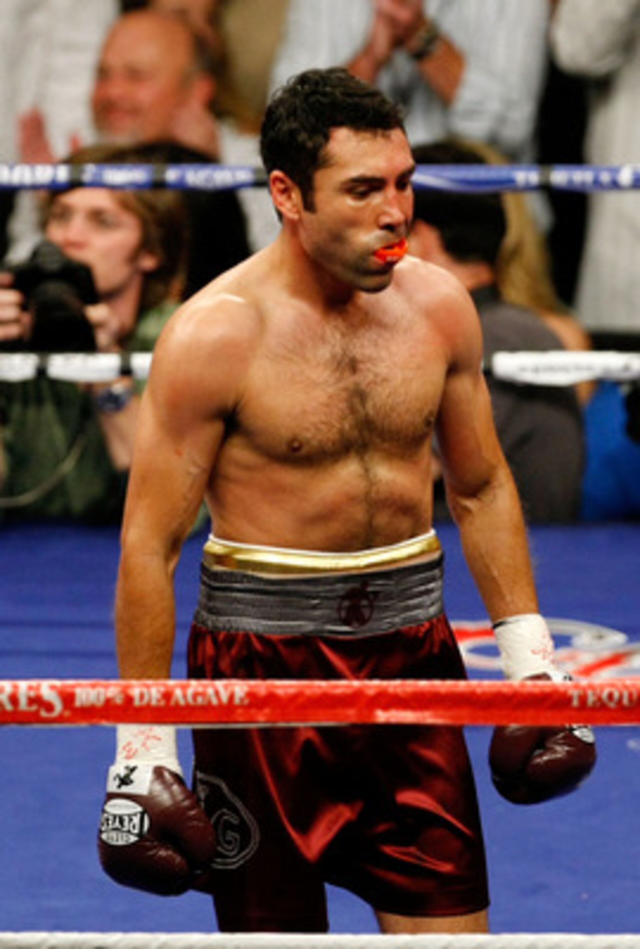 LAS VEGAS - DECEMBER 06:  Oscar De La Hoya looks on from the ring in the first round against Manny Pacquiao of the Philippines during their welterweight fight at the MGM Grand Garden Arena December 6, 2008 in Las Vegas, Nevada.  (Photo by Ethan Miller/Get
