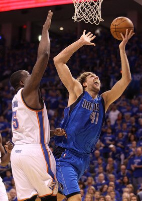 OKLAHOMA CITY, OK - MAY 23:  Dirk Nowitzki #41 of the Dallas Mavericks goes up for a shot against Kendrick Perkins #5 of the Oklahoma City Thunder in the first half of Game Four of the Western Conference Finals during the 2011 NBA Playoffs at Oklahoma Cit