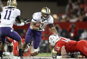 TUCSON, AZ - OCTOBER 23:  Runningback Chris Polk #1 of the Washington Huskies rushes the football during the college football game against the Arizona Wildcats at Arizona Stadium on October 23, 2010 in Tucson, Arizona. The Wildcats defeated the Huskies 44