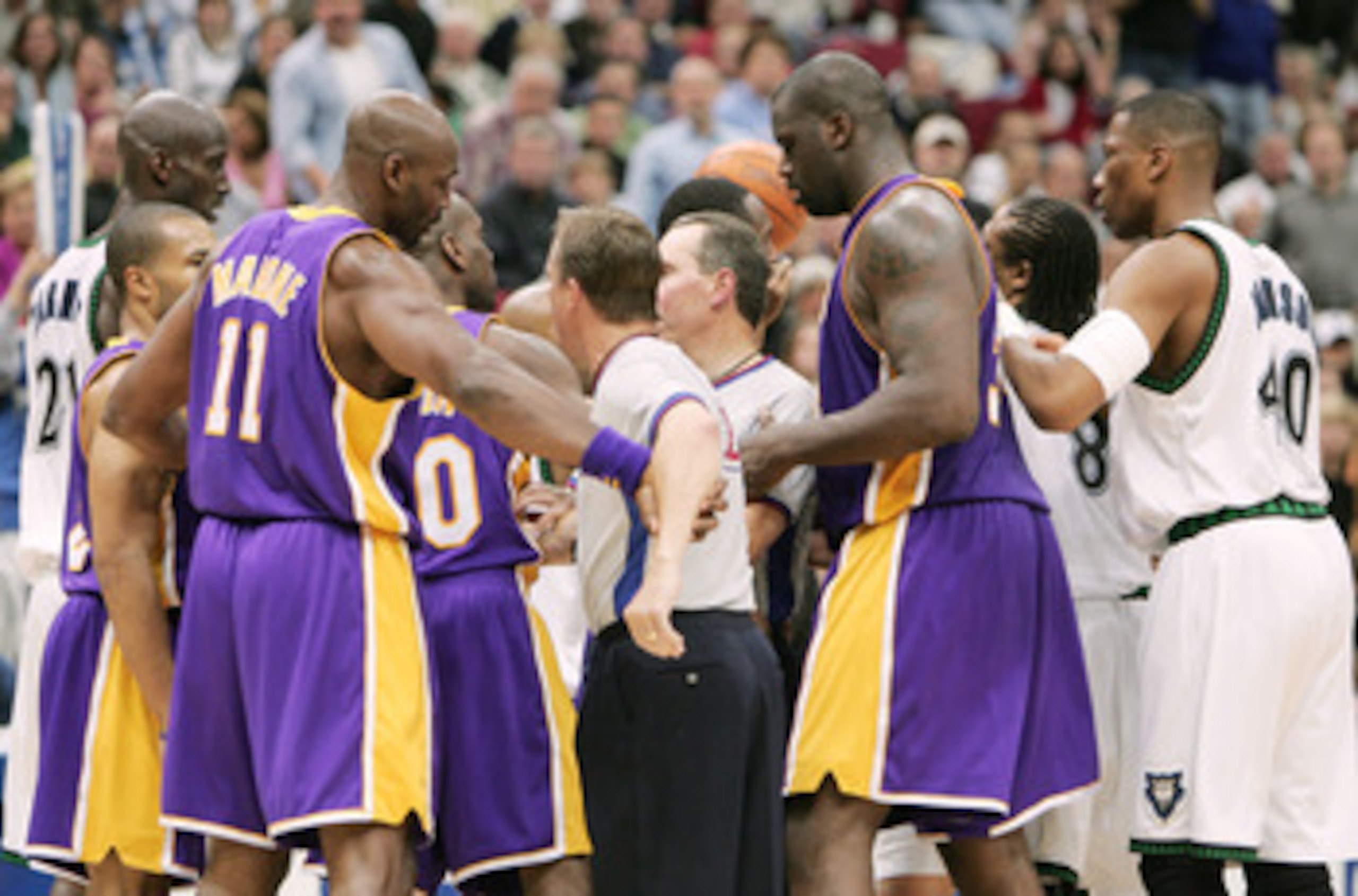 MINNEAPOLIS, MN - MAY 23: Referees break up a scuffle that started between Gary Payton #20 of the Los Angeles Lakers and Wally Szczerbiak #10 of the Minnesota Timberwolves in the second half of Game two of the Western Conference Finals during the 2004 NB MINNEAPOLIS, MN - MAY 23: Referees break up a scuffle that started between Gary Payton #20 of the Los Angeles Lakers and Wally Szczerbiak #10 of the Minnesota Timberwolves in the second half of Game two of the Western Conference Finals during the 2004 NB