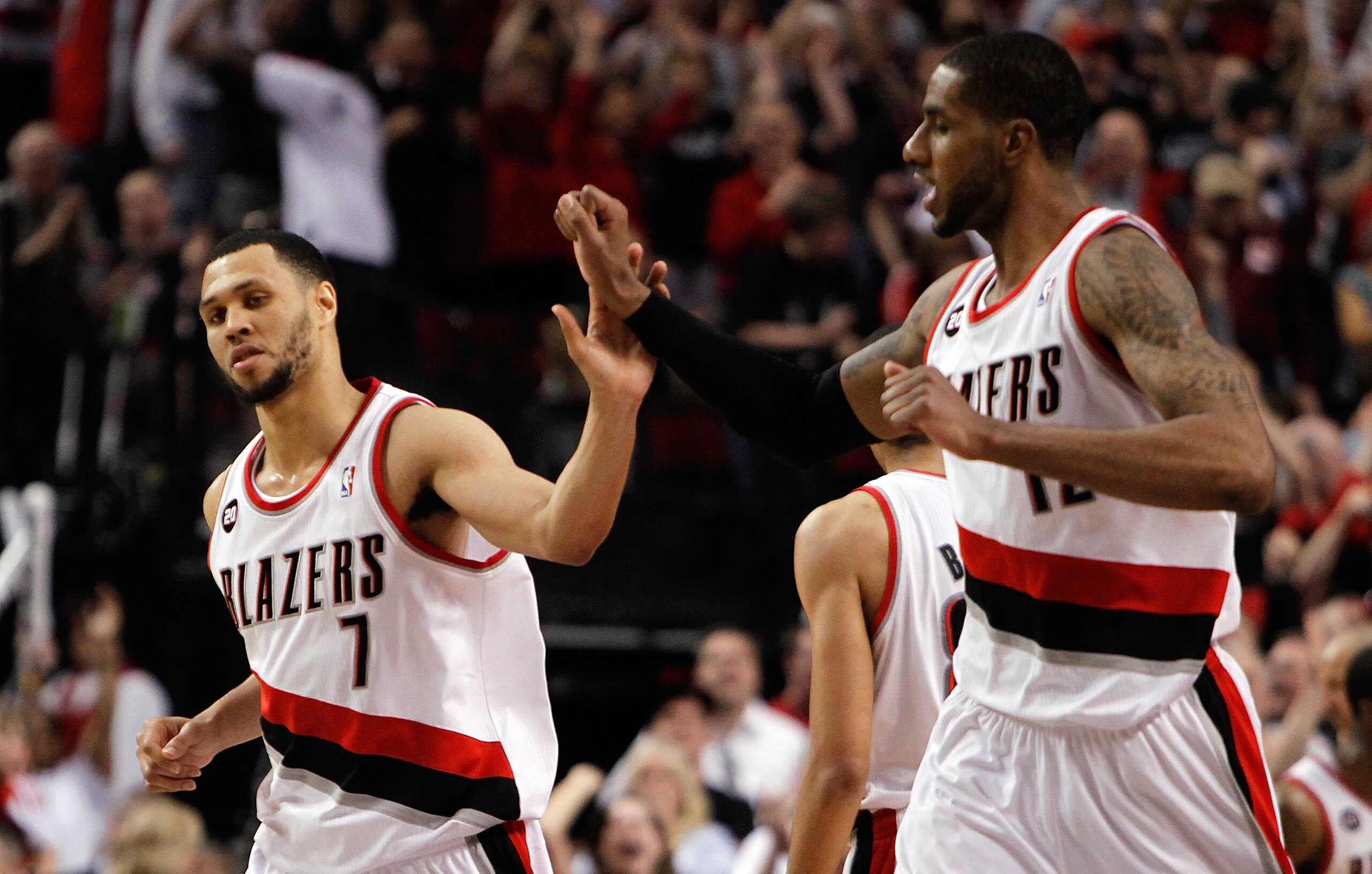 PORTLAND, OR - APRIL 23:  Brandon Roy #7 high fives LaMarcus Aldridge #12 of the Portland Trail Blazers against the Dallas Mavericks in Game Four of the Western Conference Quarterfinals in the 2011 NBA Playoffs on April 23, 2011 at the Rose Garden in Port