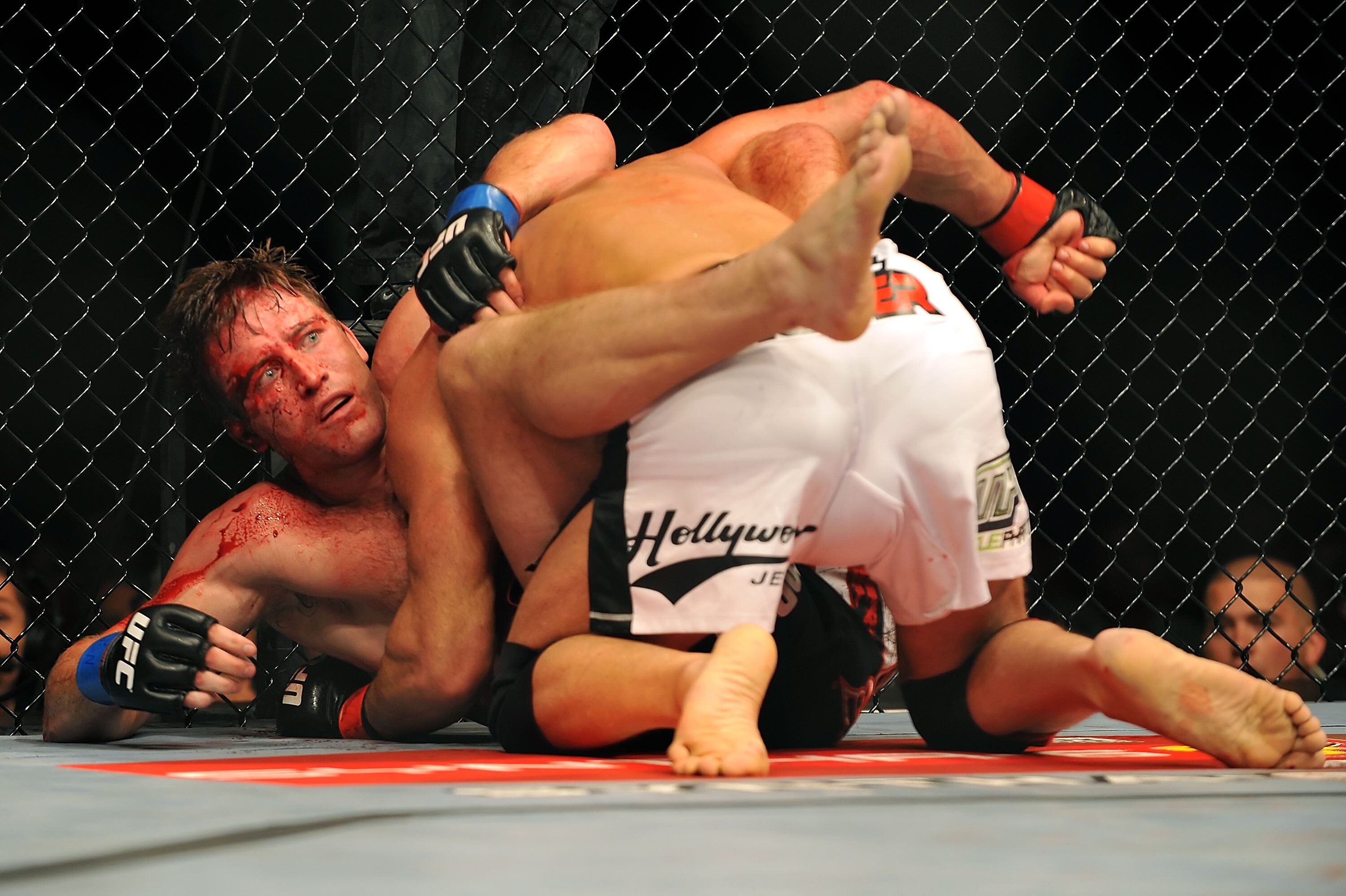 LAS VEGAS - JULY 11:  (L) Stephan Bonnar is held by Mark Coleman during their light heavyweight bout during UFC 100 on July 11, 2009 in Las Vegas, Nevada.  Coleman defeated Bonnar by unanimous decision.  (Photo by Jon Kopaloff/Getty Images)