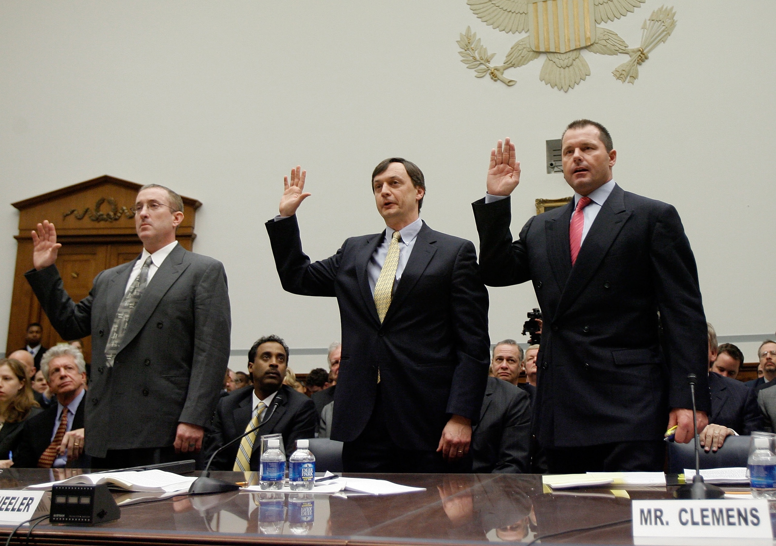 WASHINGTON - FEBRUARY 13:  (L-R) Brian McNamee, former personal trainer, Charlie Scheeler, member of the investigating staff for the Mitchell report and Major League Baseball player Roger Clemens raise their right hands as they are sworn in during a House
