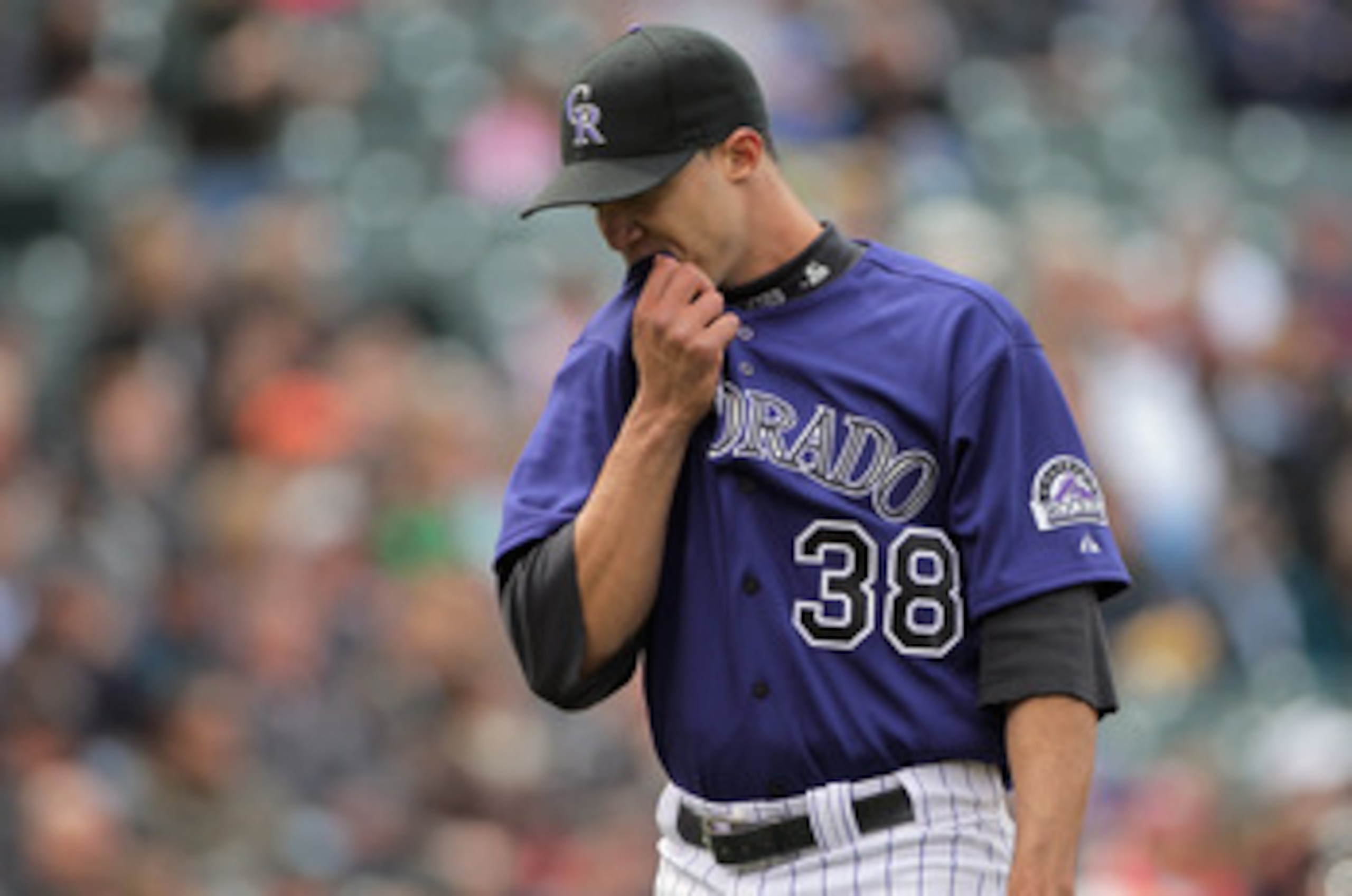 DENVER, CO - MAY 01:  Starting pitcher Ubaldo Jimenez #38 of the Colorado Rockies heads for the dugout at the end of the fourth inning agaisnt the Pittsburgh Pirates at Coors Field on May 1, 2011 in Denver, Colorado. Jimenez collected the loss as the Pira