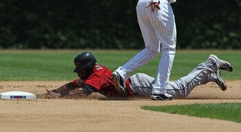 CHICAGO - JULY 21: Jason Bourgeois #11 of the Houston Astros dives into 2nd base with a steal  against the Chicago Cubs at Wrigley Field on July 21, 2010 in Chicago, Illinois. The Astros defeated the Cubs 4-3 in 12 innings. (Photo by Jonathan Daniel/Getty
