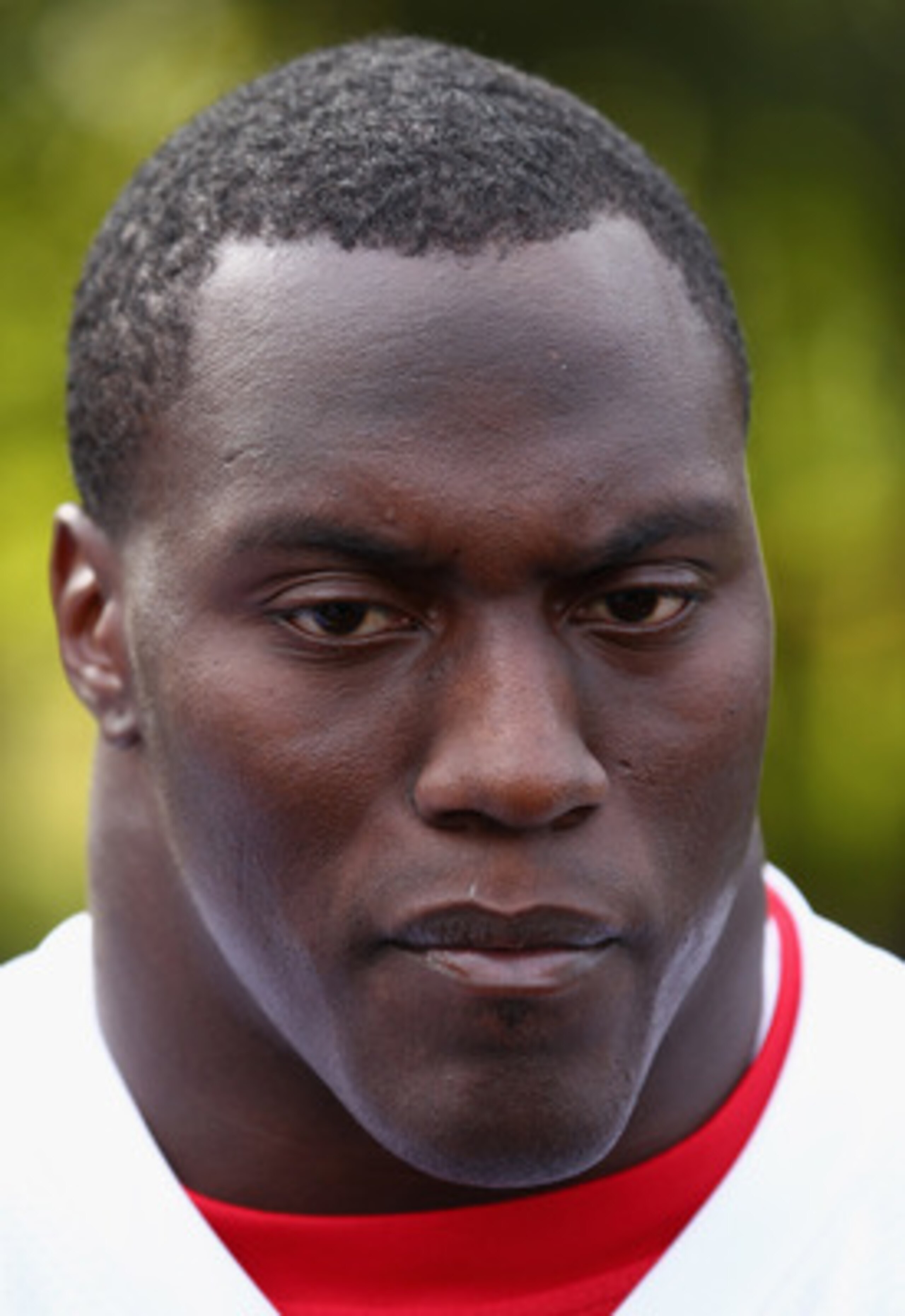 HERTFORD, ENGLAND - OCTOBER 27:  Takeo Spikes of the San Francisco 49ers talks to the media outside The Grove Hotel on October 27, 2010 in Hertford, England. The San Francisco 49ers will meet the Denver Broncos in the NFL International Series regular-seas
