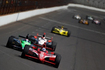 INDIANAPOLIS - MAY 28:  Dario Franchitti of Scotland, driver of the #10 Target Chip Ganassi Racing Dallara Honda, leads Danica Patrick, driver of the #7 Andretti Autosport Dallara Honda, during practice for the IZOD IndyCar Series 94th running of the Indi