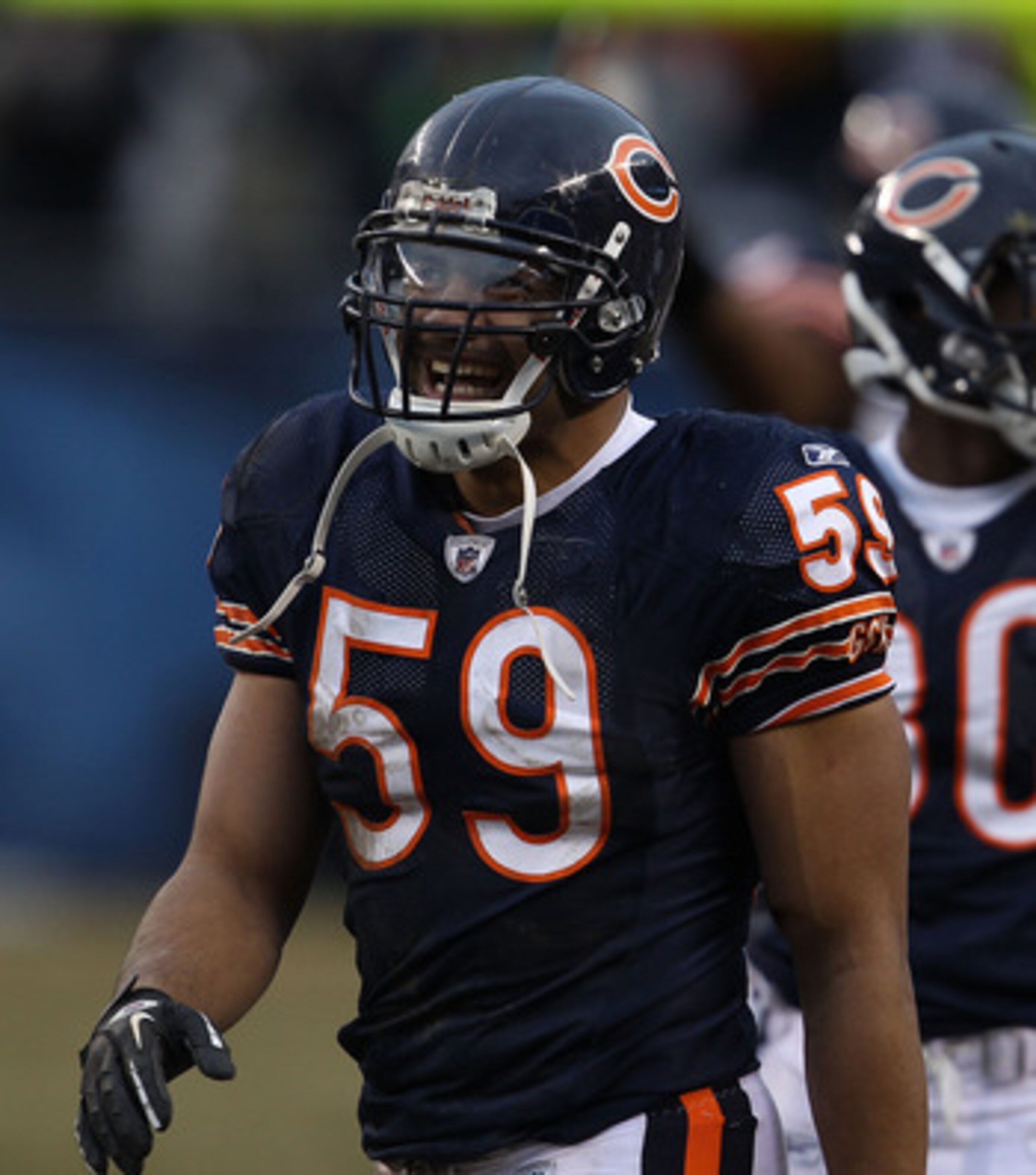 CHICAGO, IL - DECEMBER 26: Pisa Tinoisamoa #59 of the Chicago Bears smiles after teammate Chris Harris intercepted a pass in the final minutes against the New York Jets at Soldier Field on December 26, 2010 in Chicago, Illinois. The Bears defeated the Jet