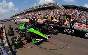 INDIANAPOLIS - MAY 28:  The crew for Danica Patrick, driver of the #7 Team Godaddy.com Andretti Autosport Dallara Honda, work on her car during the pit stop challenge prior to the IZOD IndyCar Series 94th running of the Indianapolis 500 at the Indianapoli