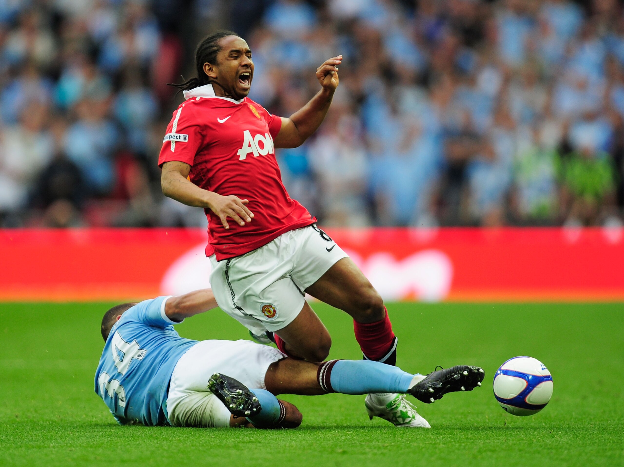 LONDON, ENGLAND - APRIL 16:  Nigel de Jong of Manchester City tackles Anderson of Manchester United during the FA Cup sponsored by E.ON semi final match between Manchester City and Manchester United at Wembley Stadium on April 16, 2011 in London, England.