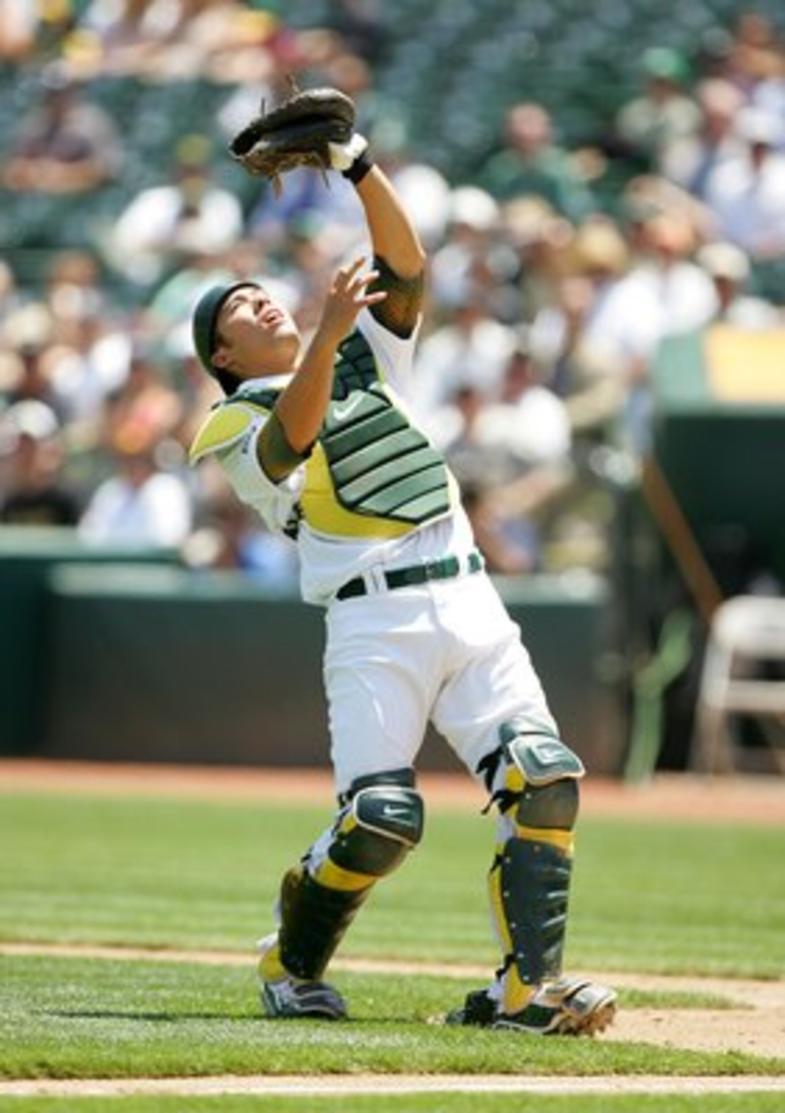 OAKLAND, CA - MAY 27:  Kurt Suzuki #8 of the Oakland Athletics catches a pop up during their game against the Seattle Mariners at the Oakland Coliseum on May 27, 2009 in Oakland, California.  (Photo by Ezra Shaw/Getty Images)