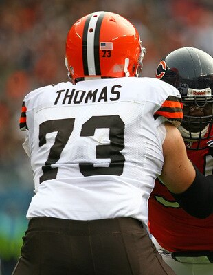 CHICAGO - NOVEMBER 01: Tommie Harris #91 of the Chicago Bears is double-teamed blocked by Joe Thomas #73 and Eric Steinbach #65 of the Cleveland Browns at Soldier Field on November 1, 2009 in Chicago, Illinois. The Bears defeated the Browns 30-6. (Photo b