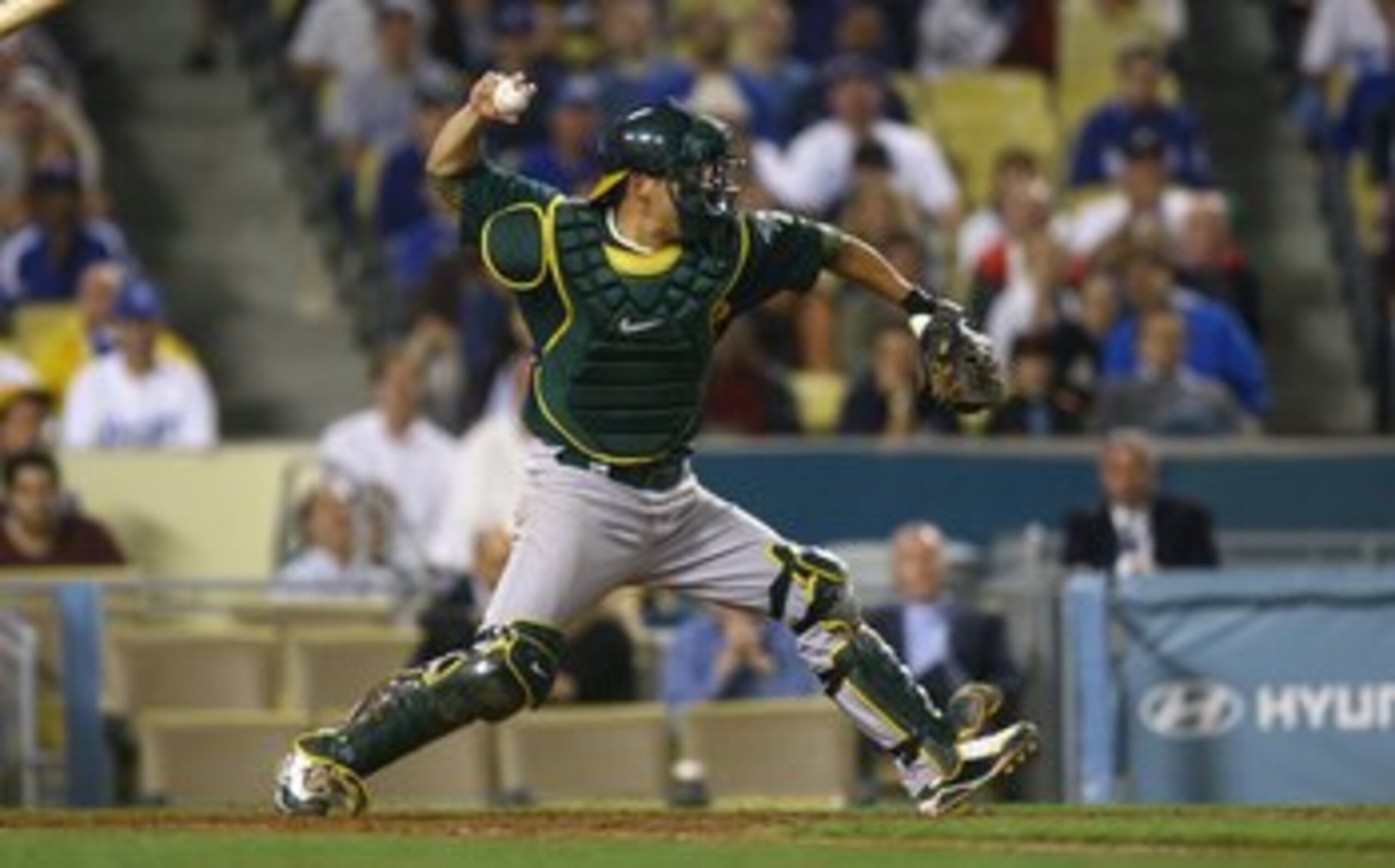 LOS ANGELES, CA - JUNE 16:  Kurt Suzuki #8 of the Oakland Athletics fields against the Los Angeles Dodgers at Dodger Stadium on June 16, 2009 in Los Angeles, California. The Dodgers defeated the Athletics 5-4 in ten innings.  (Photo by Jeff Gross/Getty Im