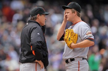 DENVER, CO - APRIL 20:  Pitching coach Dave Righetti (L) visiting mound to talk with starting pitcher Matt Cain #18 of the San Francisco Giants as he faces the Colorado Rockies at Coors Field on April 20, 2011 in Denver, Colorado.  (Photo by Doug Pensinge