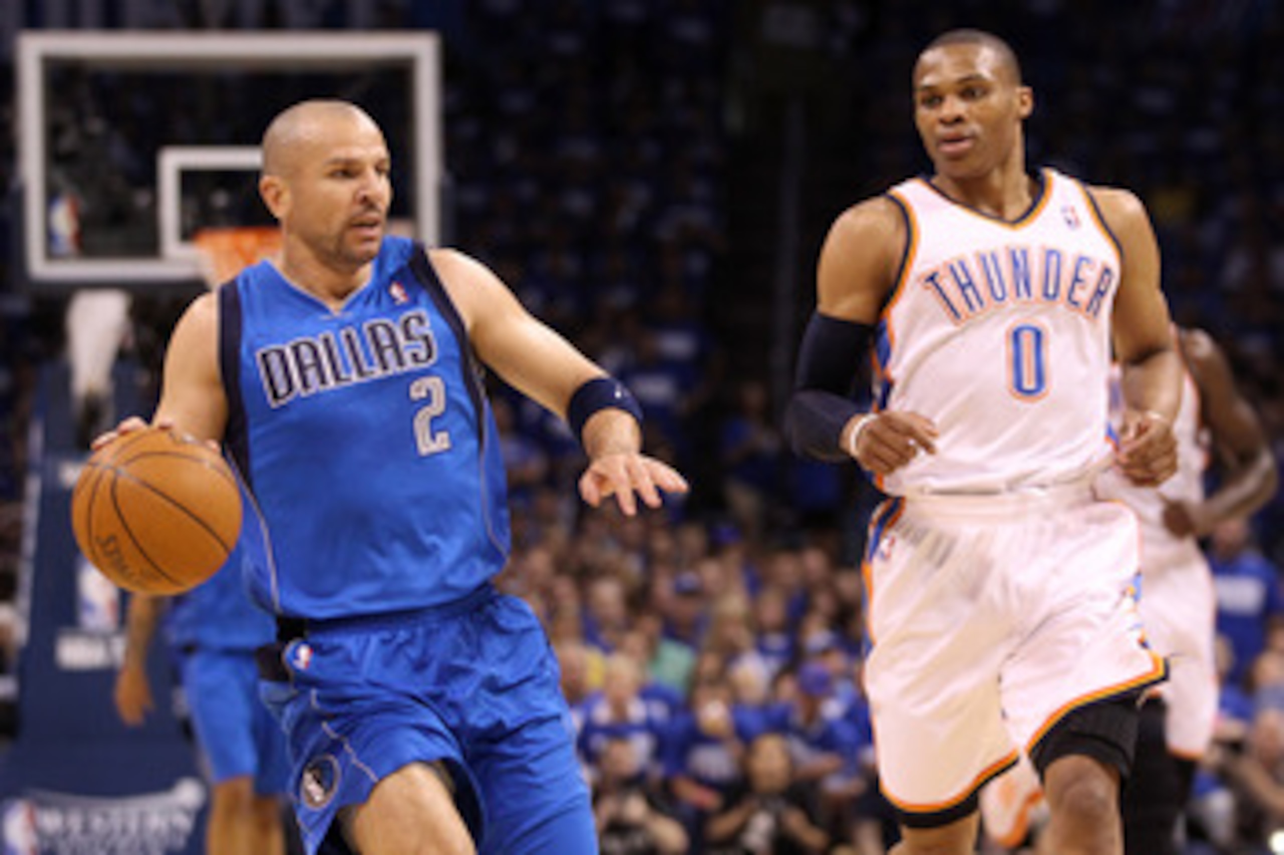 OKLAHOMA CITY, OK - MAY 21:  Jason Kidd #2 of the Dallas Mavericks moves the ball alongside Russell Westbrook #0 of the Oklahoma City Thunder in Game Three of the Western Conference Finals during the 2011 NBA Playoffs at Oklahoma City Arena on May 21, 201