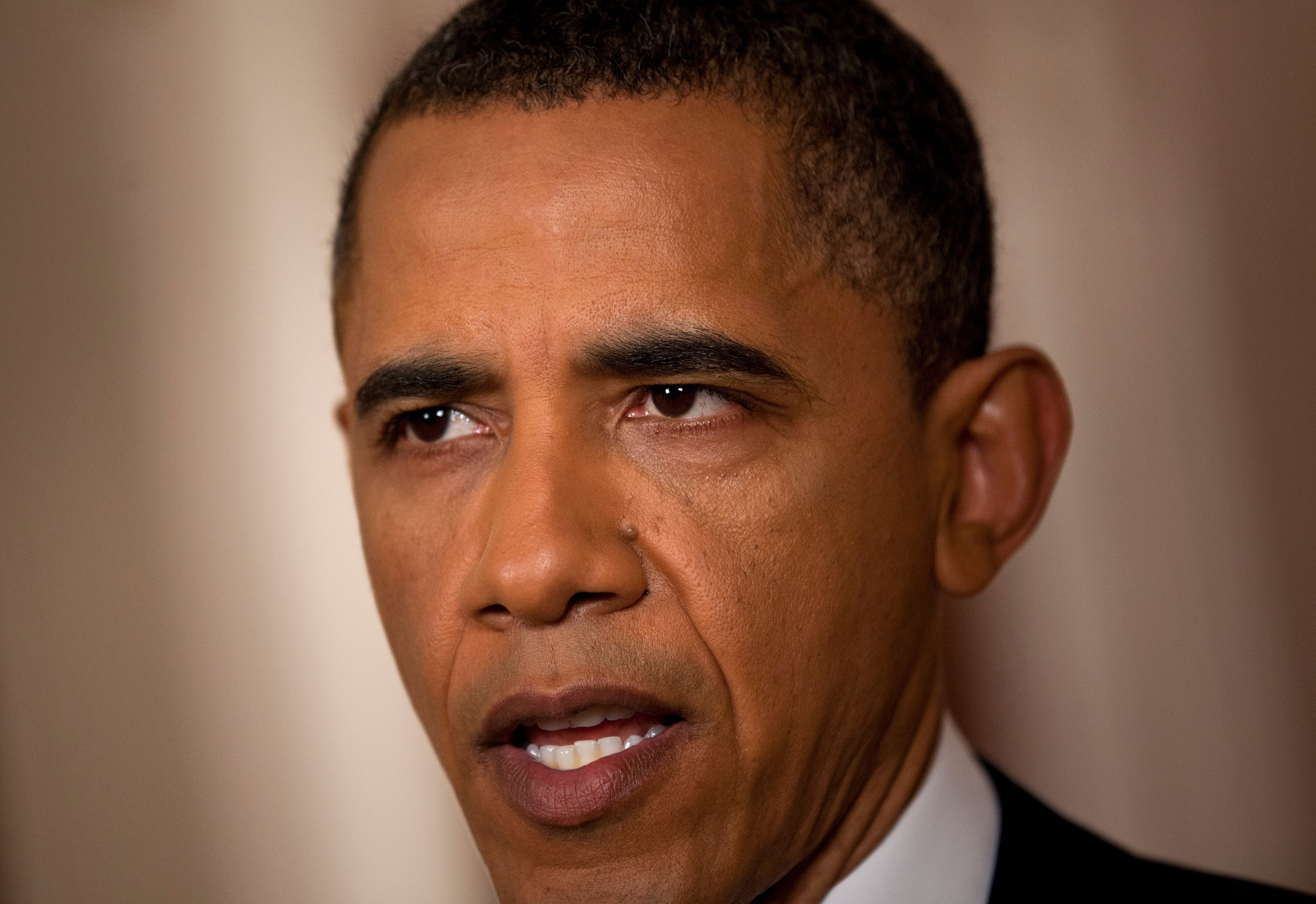 WASHINGTON, DC - MAY 1:  (AFP OUT) U.S. President Barack Obama speaks after addressing the nation on TV from the East Room of the White House to make a televised statement May 1, 2011 in Washington, DC.  Bin Laden has been killed near Islamabad, Pakistan