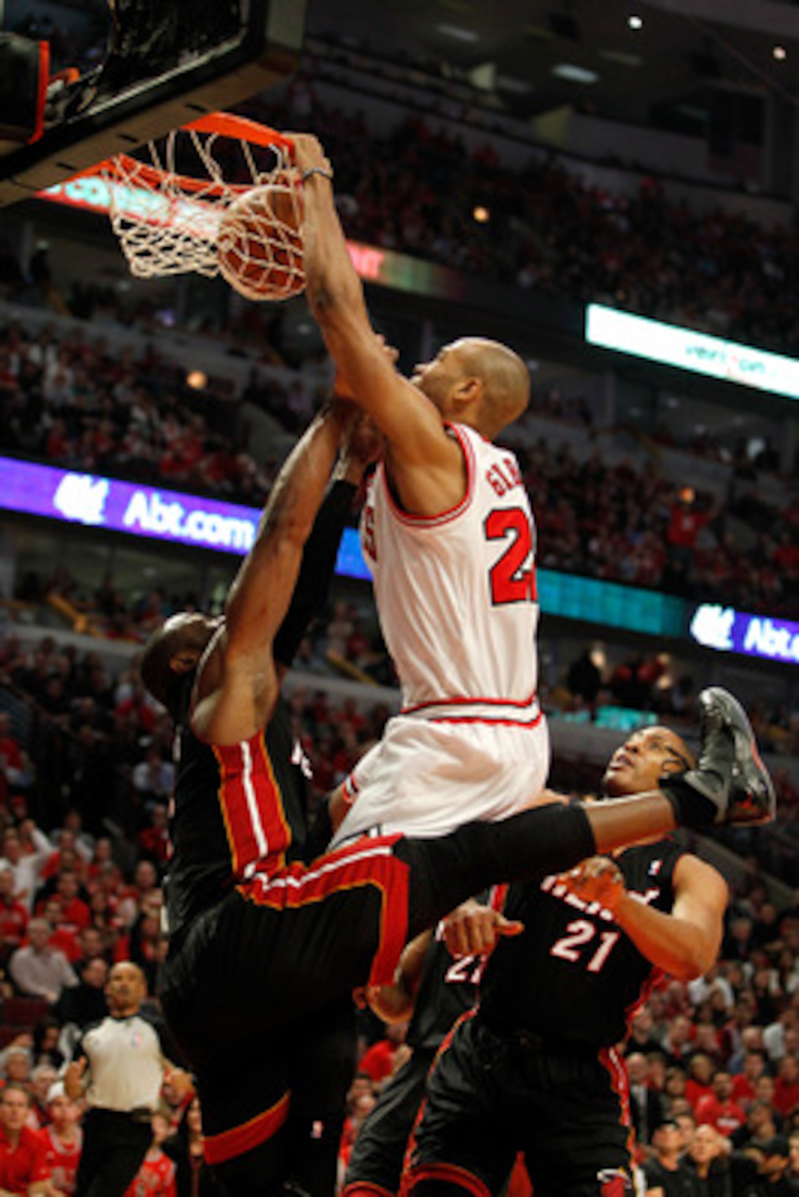 CHICAGO, IL - MAY 15:  Taj Gibson #22 of the Chicago Bulls dunks against Dwyane Wade #3 of the Miami Heat in Game One of the Eastern Conference Finals during the 2011 NBA Playoffs on May 15, 2011 at the United Center in Chicago, Illinois. The Bulls won 10