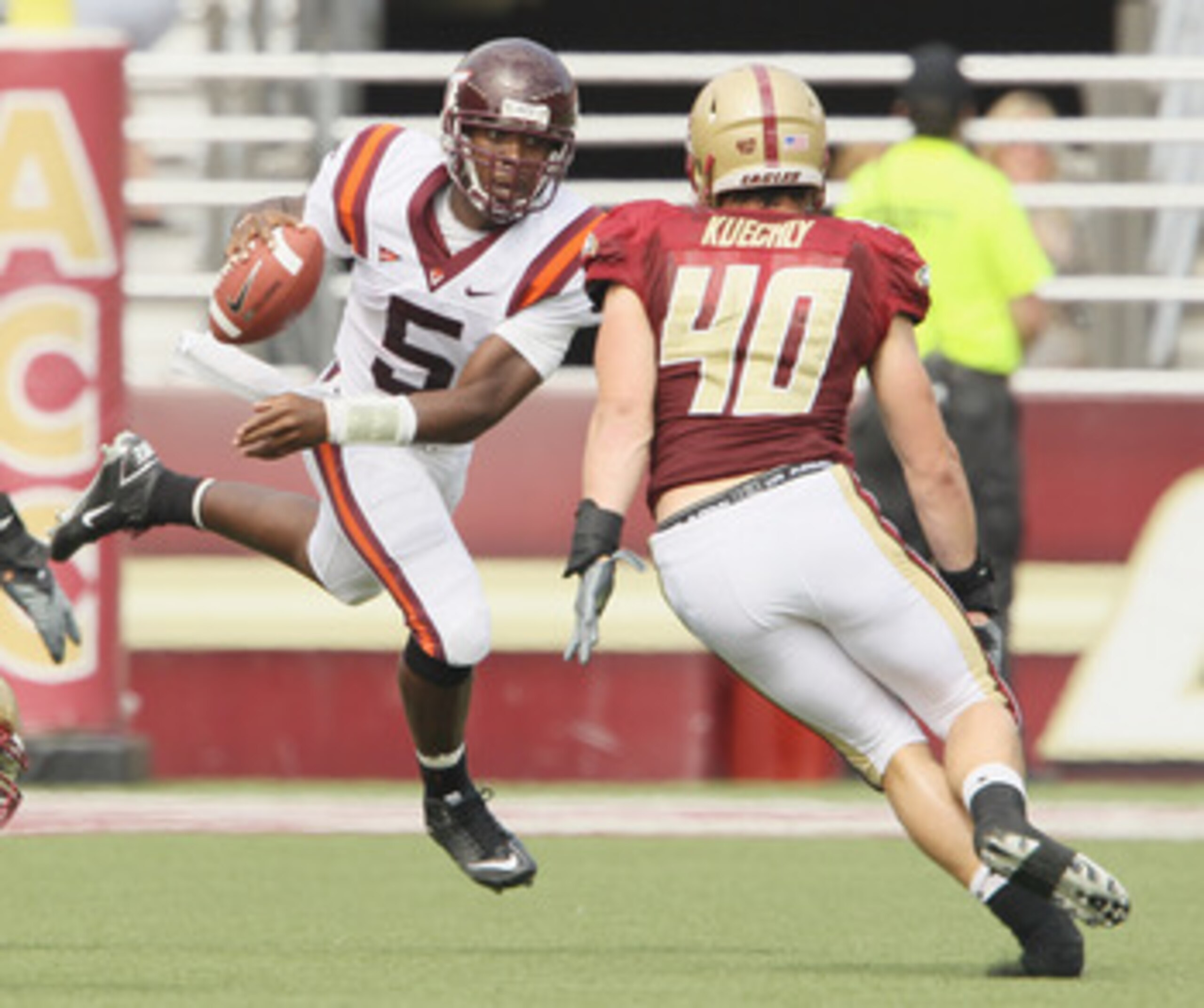 CHESTNUT HILL, MA - SEPTEMBER 25:  Tyrod Taylor #5 of the Virginia Tech Hokies scrambles with the ball as Luke Kuechly #40 of the Boston College Eagles defends on September 25, 2010 at Alumni Stadium in Chestnut Hill, Massachusetts.  (Photo by Elsa/Getty