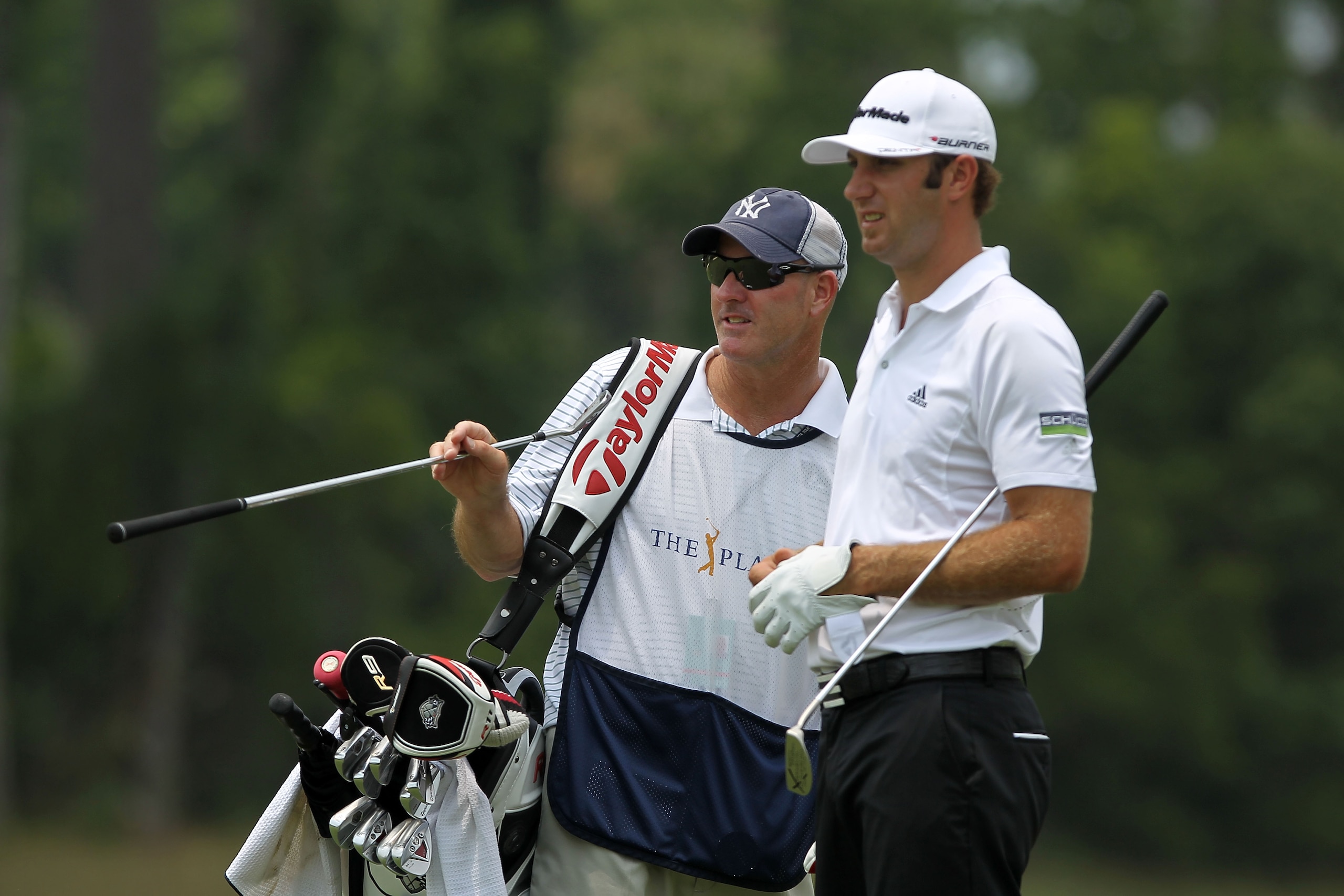 PONTE VEDRA BEACH, FL - MAY 14:  Caddie Joe Lacava chats with his player Dustin Johnson on the fifth hole during the third round of THE PLAYERS Championship held at THE PLAYERS Stadium course at TPC Sawgrass on May 14, 2011 in Ponte Vedra Beach, Florida.