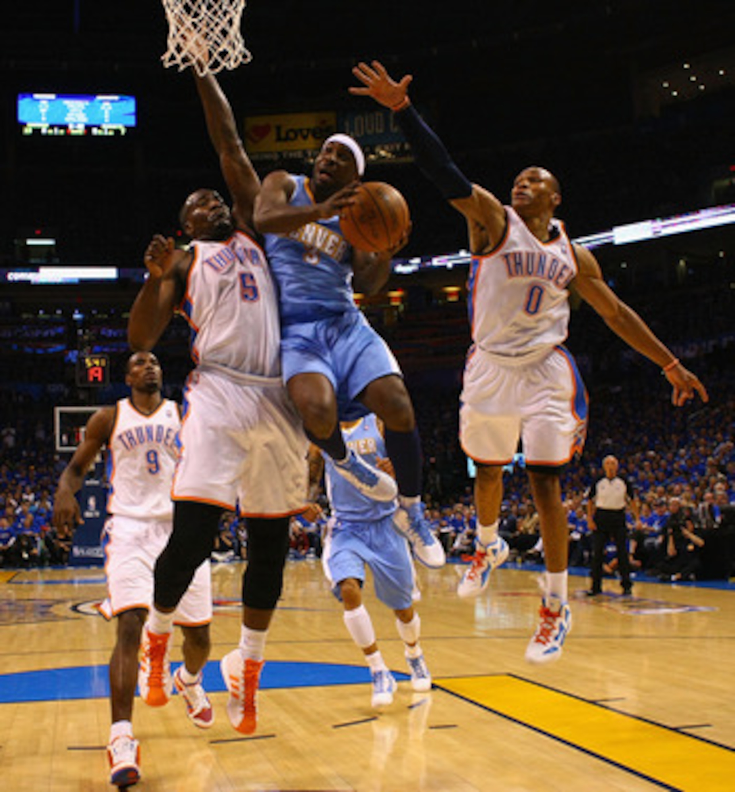 OKLAHOMA CITY, OK - APRIL 20: Ty Lawson #3 of the Denver Nuggets drives to the basket against Kendrick Perkins #5 and Russell Westbrook #0 both of the Oklahoma City Thunder in Game Two of the Western Conference Quarterfinals in the 2011 NBA Playoffs on Ap