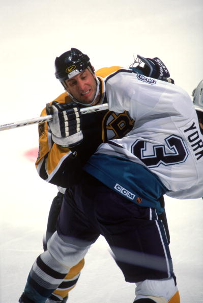 21 Feb 1996:  Right-winger Cam Neely of the Boston Bruins and a Anaheim Mighty Ducks player get tangled during a game at Arowhead Pond in Anaheim, California.  The Mighty Ducks won the game, 4-3. Mandatory Credit: Glenn Cratty  /Allsport