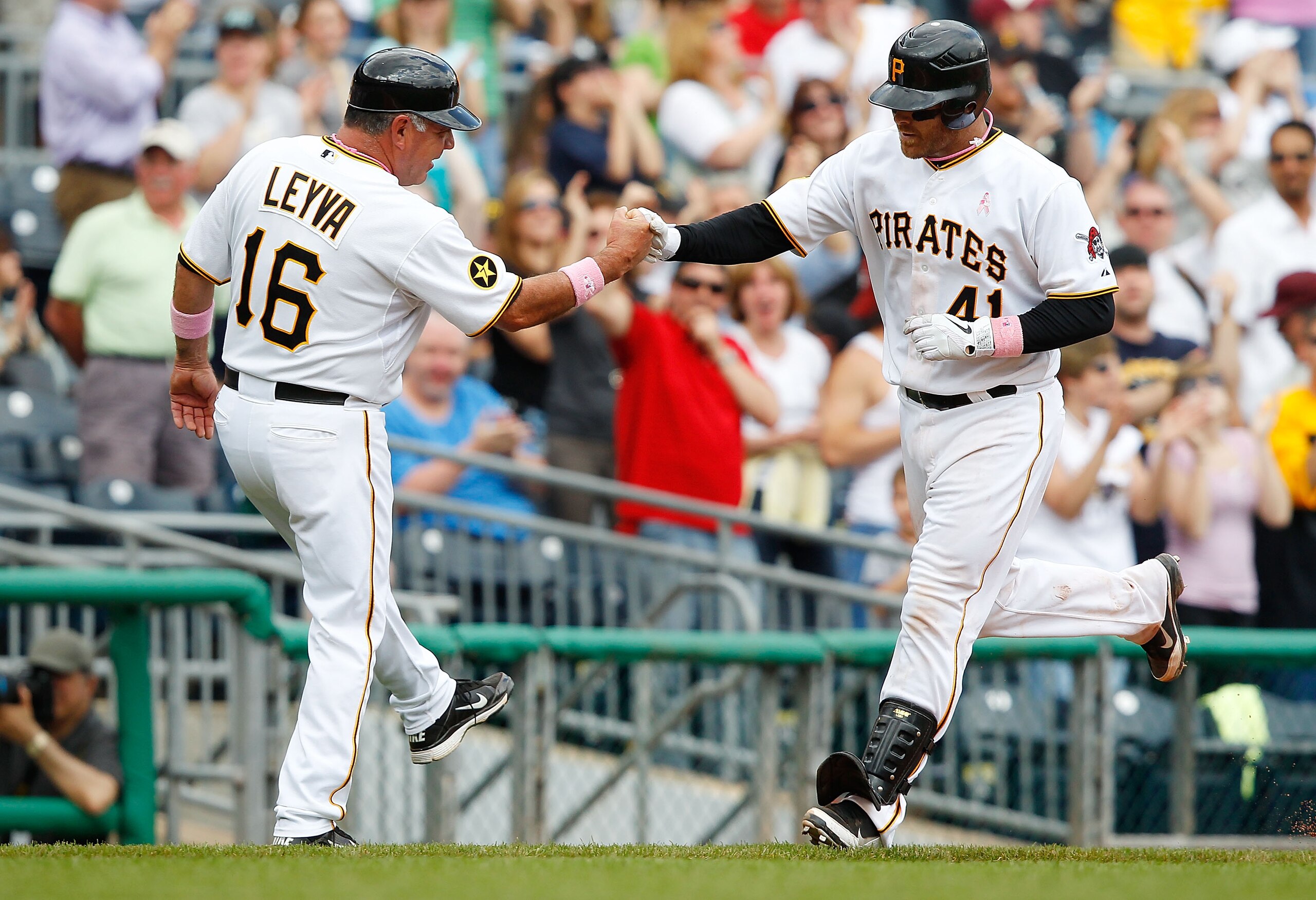 PITTSBURGH - MAY 08:  Ryan Doumit #41 of the Pittsburgh Pirates celebrates with third base coach Nick Leyva #16 after hitting a three run home run against the Houston Astros during the game on May 8, 2011 at PNC Park in Pittsburgh, Pennsylvania.  (Photo b