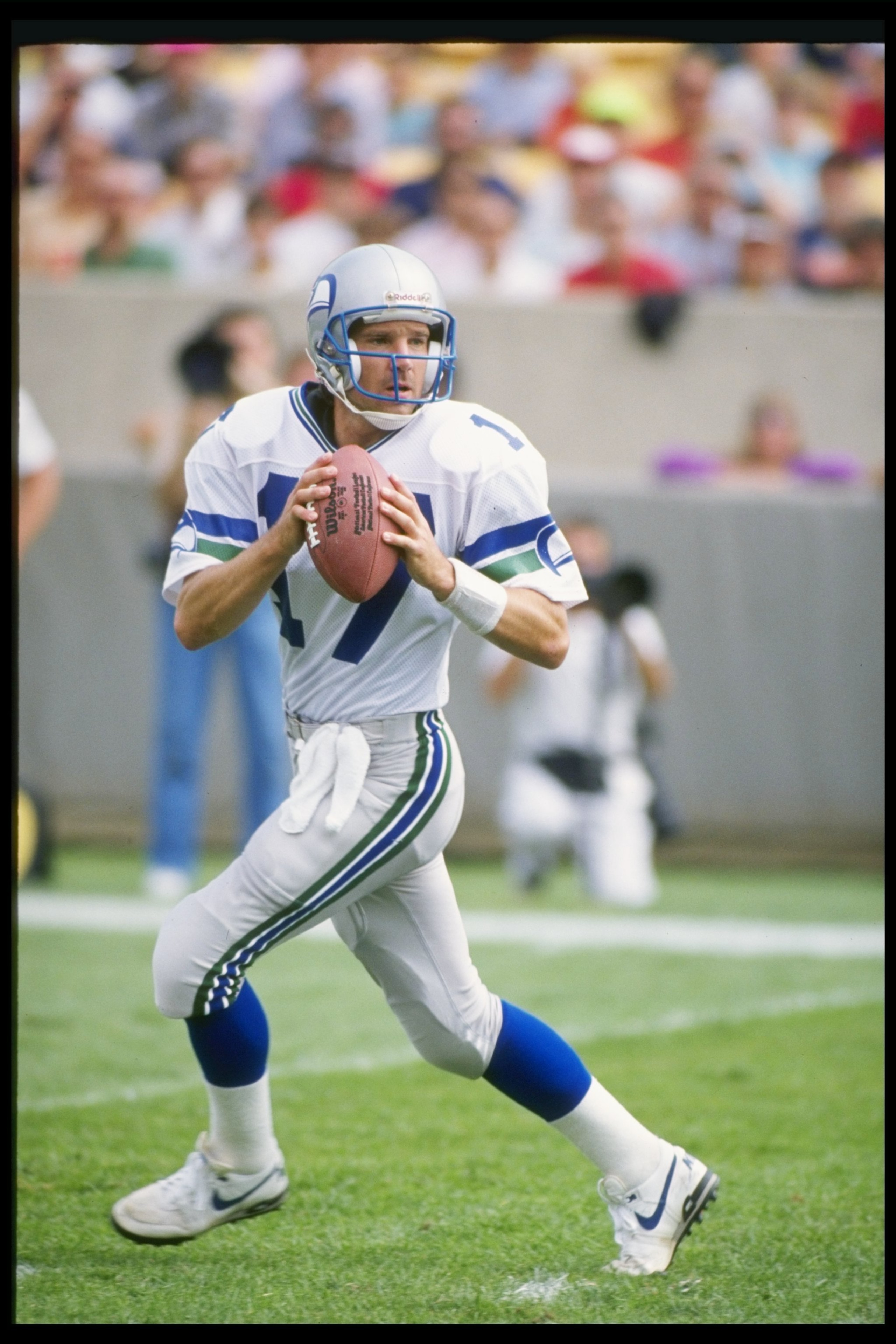 Quarterback Dave Krieg of the Seattle Seahawks looks to pass the ball during a game against the Chicago Bears at Soldier Field in Chicago, Illinois. The Bears won the game, 17-0.
