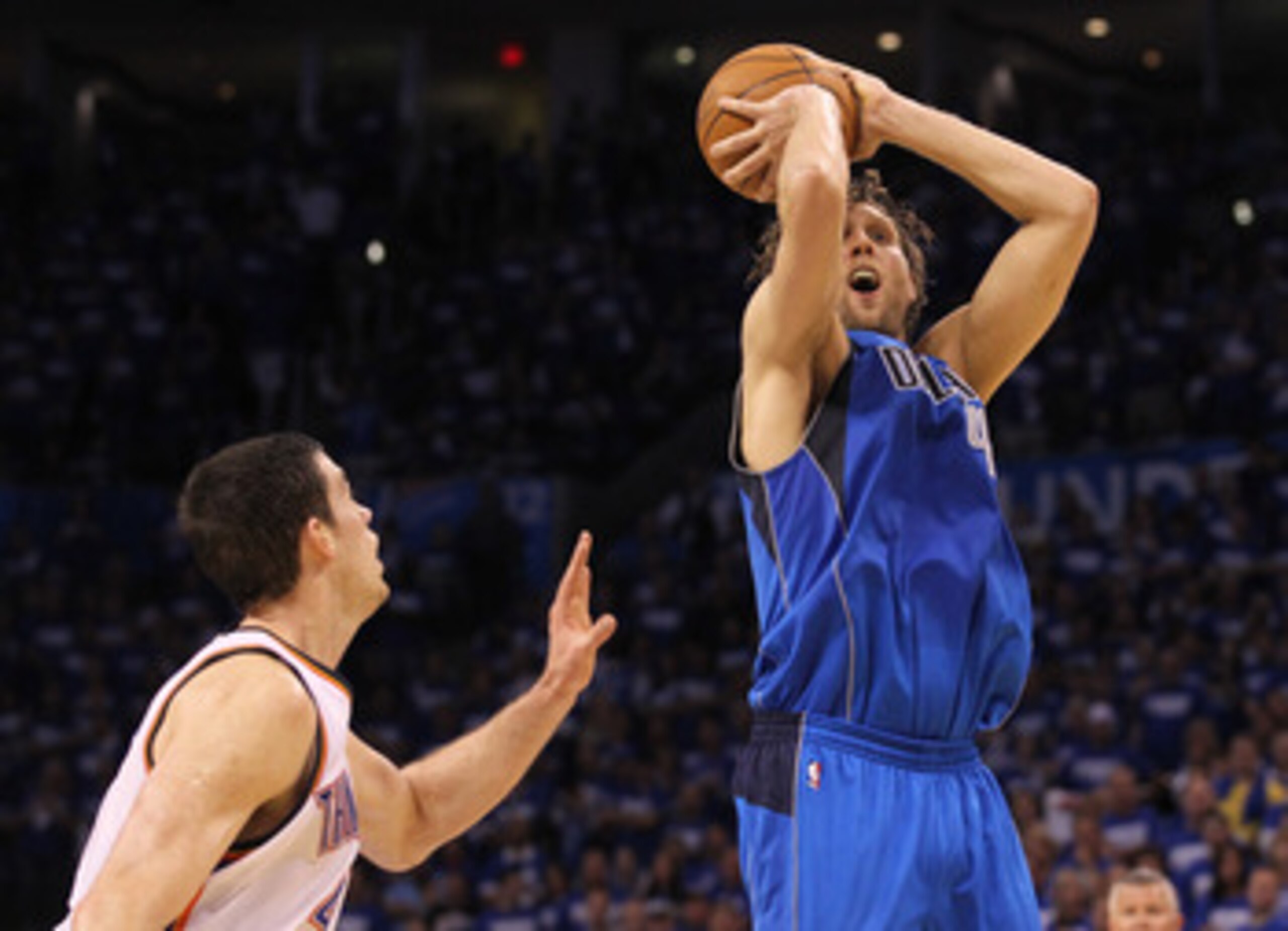 OKLAHOMA CITY, OK - MAY 21:  Dirk Nowitzki #41 of the Dallas Mavericks goes up for a shot against Nick Collison #4 of the Oklahoma City Thunder in Game Three of the Western Conference Finals during the 2011 NBA Playoffs at Oklahoma City Arena on May 21, 2