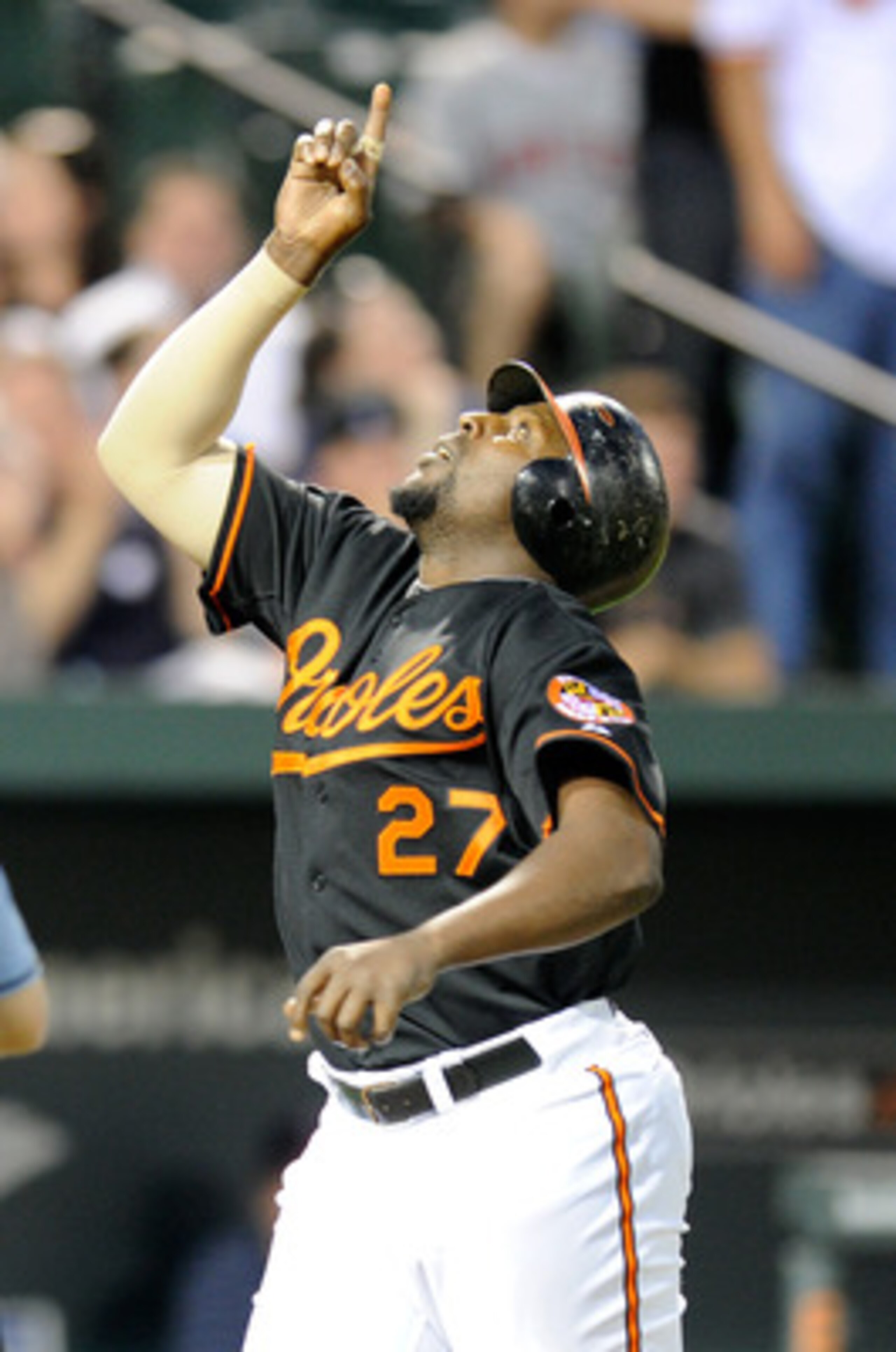 BALTIMORE, MD - APRIL 20:  Vladimir Guerrero #27 of the Baltimore Orioles celebrates after hitting a home run in the third inning against the Minnesota Twins at Oriole Park at Camden Yards on April 20, 2011 in Baltimore, Maryland.  (Photo by Greg Fiume/Ge