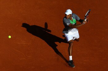 PARIS, FRANCE - MAY 25:  Jo-Wilfried Tsonga of France hits a backhand during the men's singles round two match between Igor Andreev of Russia and Jo-Wilfried Tsonga of France on day four of the French Open at Roland Garros on May 25, 2011 in Paris, France