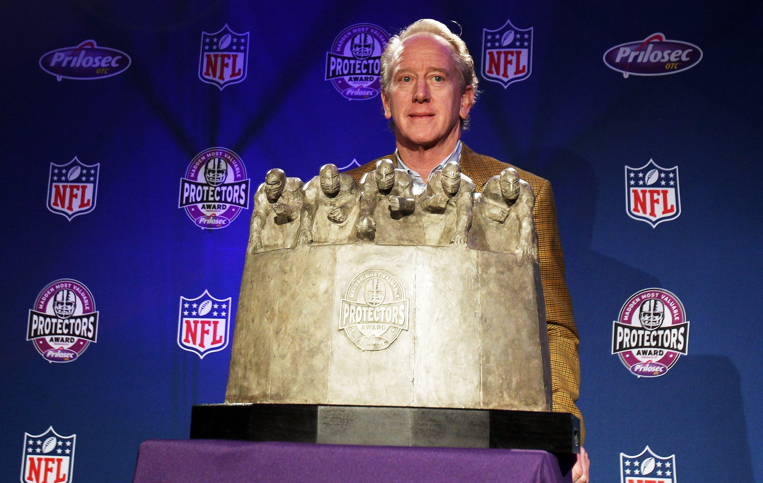 FT. LAUDERDALE, FL - FEBRUARY 03:  New Orleans Saints legend Archie Manning poses with the award on behalf of the New Orleans Saints offensive line during the Madden Most Valuable Protectors Award Press Conference on February 3, 2010 at the Ft. Lauderdale