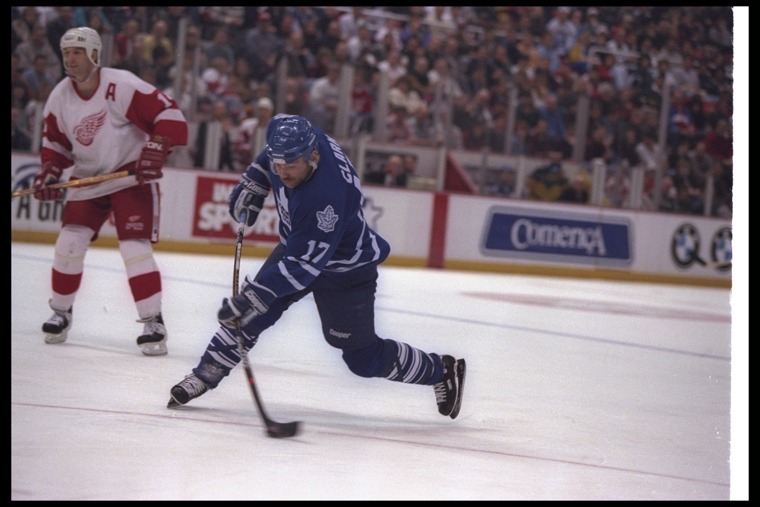 27 Nov 1996: Leftwinger Wendel Clark of the Toronto Maple Leafs moves the puck as Detroit Red Wings player Brendan Shanahan looks on during a game at Joe Louis Arena in Detroit, Michigan. The Red Wings won the game, 5-2. Mandatory Credit: Rick Stewart 27 Nov 1996: Leftwinger Wendel Clark of the Toronto Maple Leafs moves the puck as Detroit Red Wings player Brendan Shanahan looks on during a game at Joe Louis Arena in Detroit, Michigan. The Red Wings won the game, 5-2. Mandatory Credit: Rick Stewart