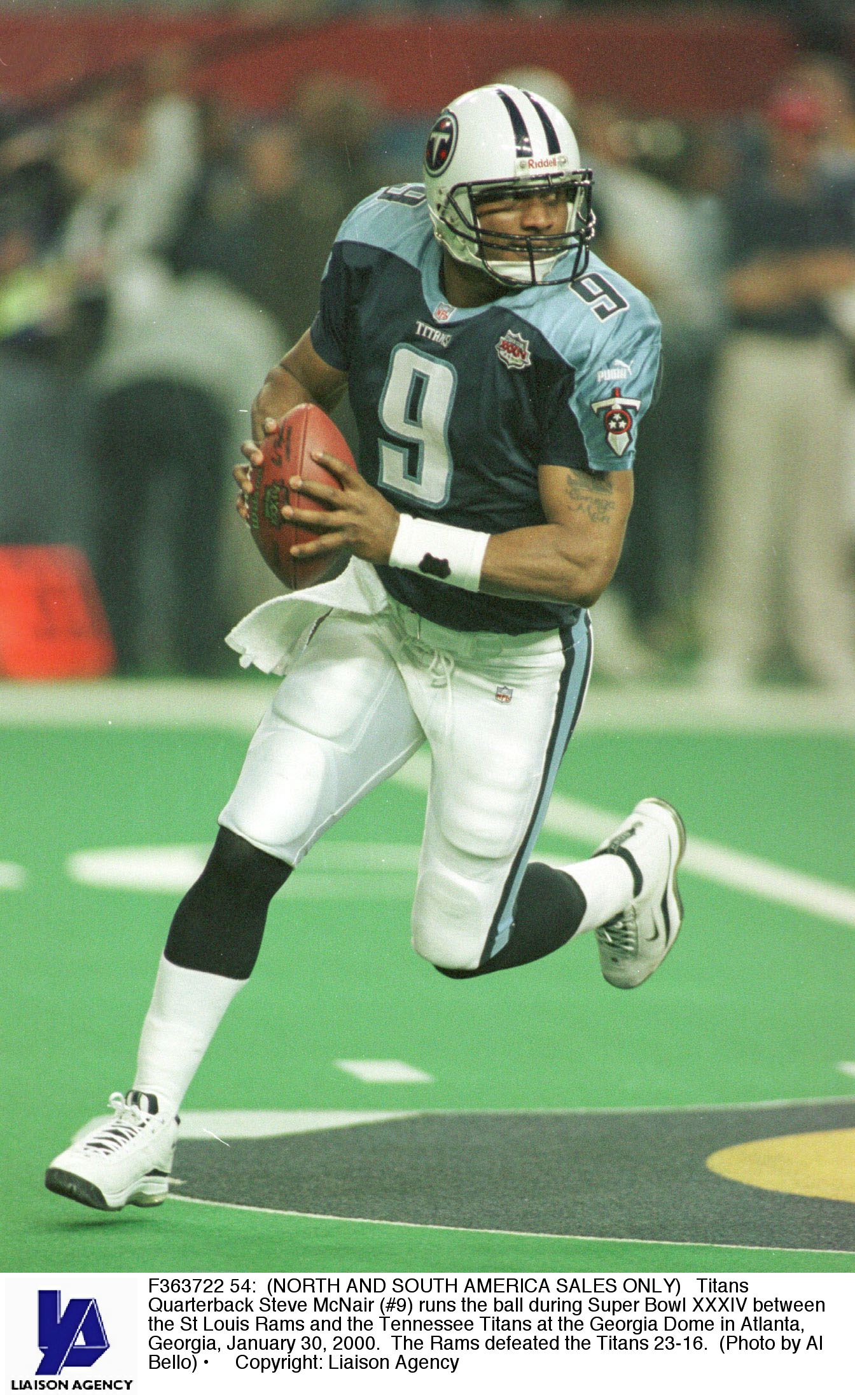 F363722 54: (NORTH AND SOUTH AMERICA SALES ONLY) Titans Quarterback Steve McNair (#9) runs the ball during Super Bowl XXXIV between the St Louis Rams and the Tennessee Titans at the Georgia Dome in Atlanta, Georgia, January 30, 2000. The Rams defeated the