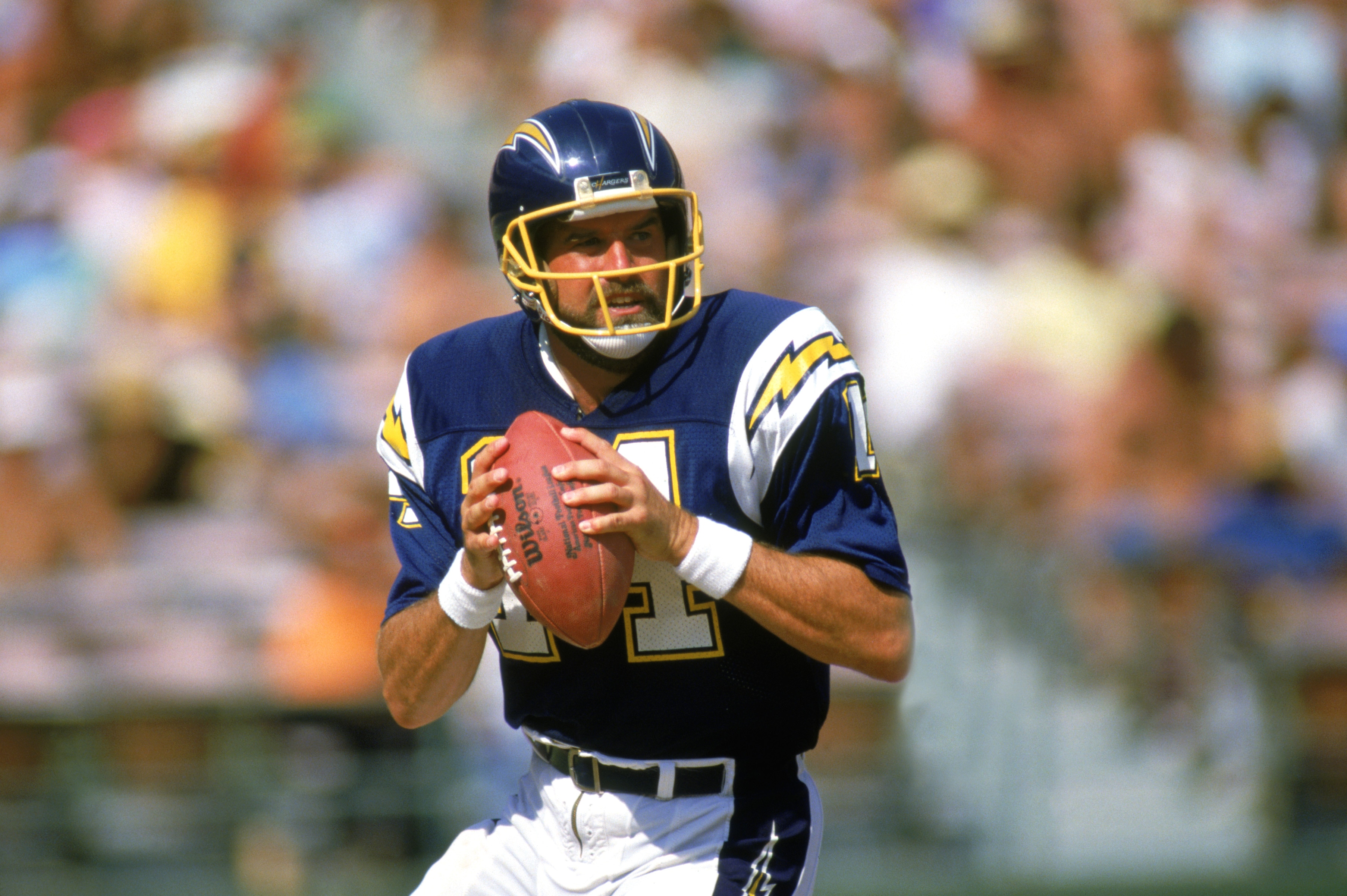SAN DIEGO -1987: Dan Fouts #14 of the San Diego Chargers looks to pass during a 1987 NFL season game at Jack Murphy Stadium in San Diego, California. ( Photo by: Stephen Dunn/Getty Images)